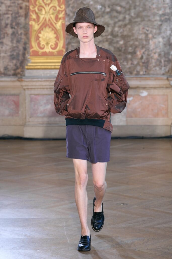 brown silk jacket with purple shorts