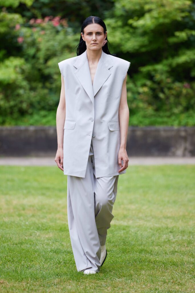 An oversized gray tailored blazer paired with matching gray pants for a chic look.