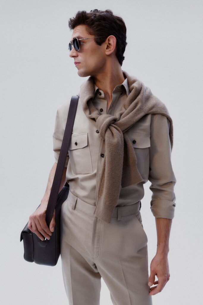 A fitted beige long-sleeve shirt with a collar paired with matching pants.