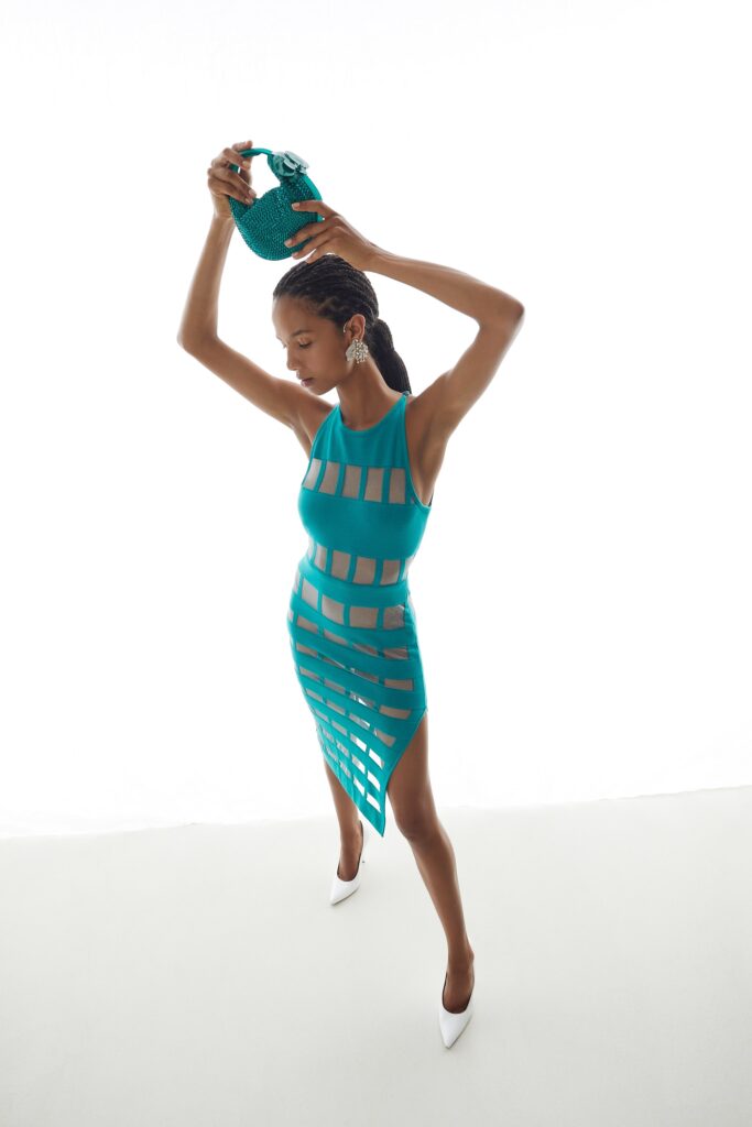 teal cutout midi dress with white shoes