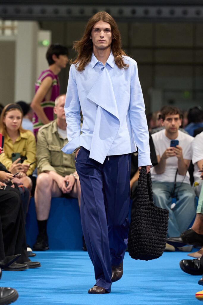 A relaxed blue cotton long-sleeve collared shirt paired with matching pants featuring an asymmetric design.