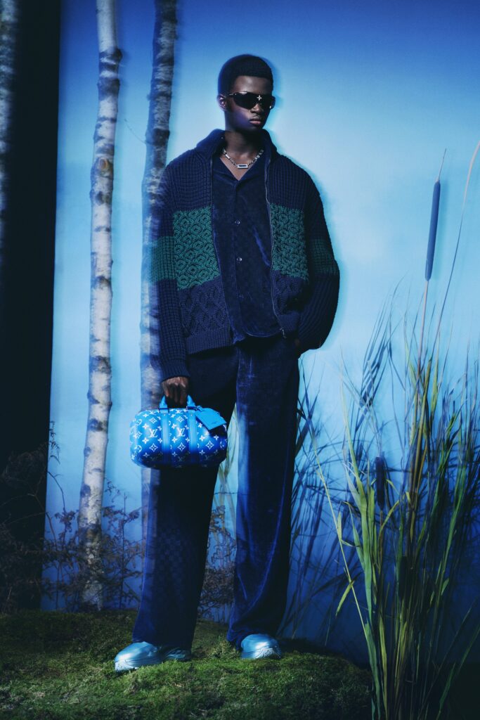 A relaxed blue long-sleeve sweater with collared detail paired with matching pants.