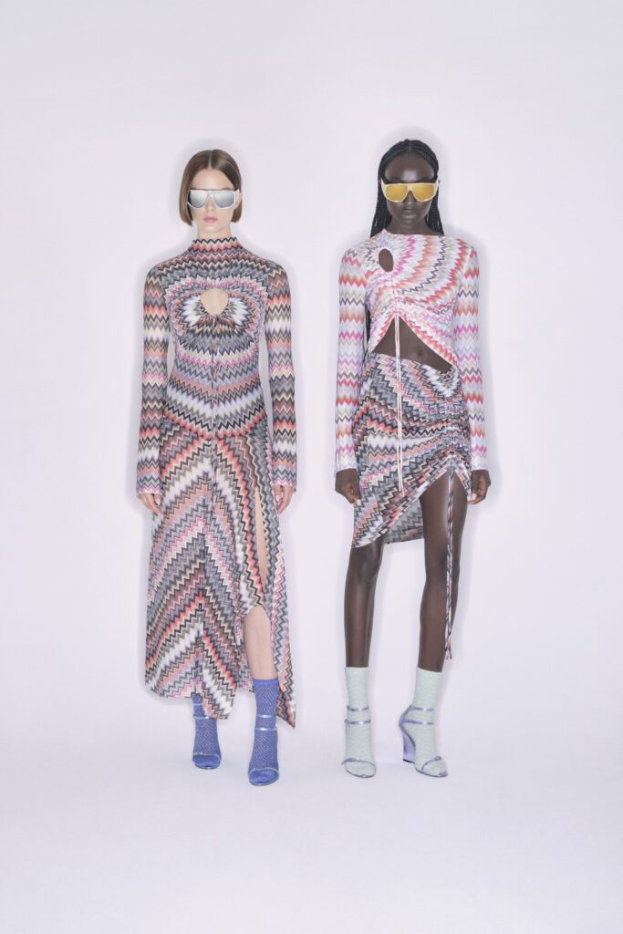 A fitted multicolor knit dress with long sleeves and an asymmetric design.