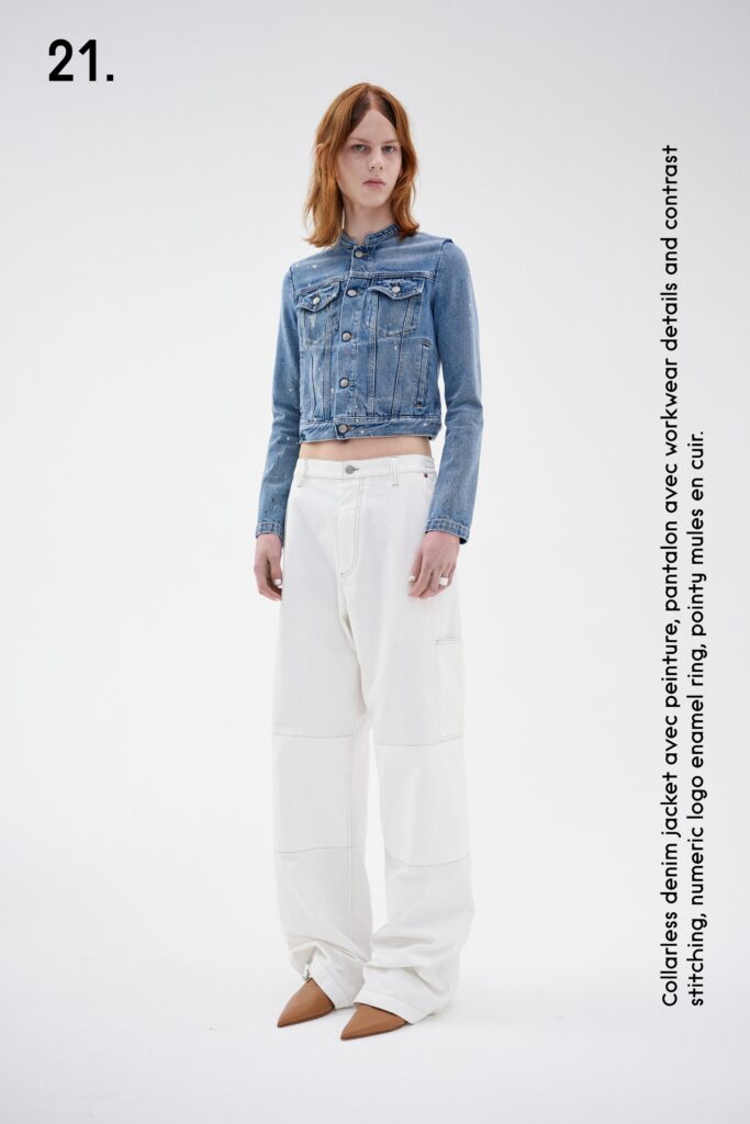 A relaxed blue denim jacket with long sleeves paired with wide-leg white pants.