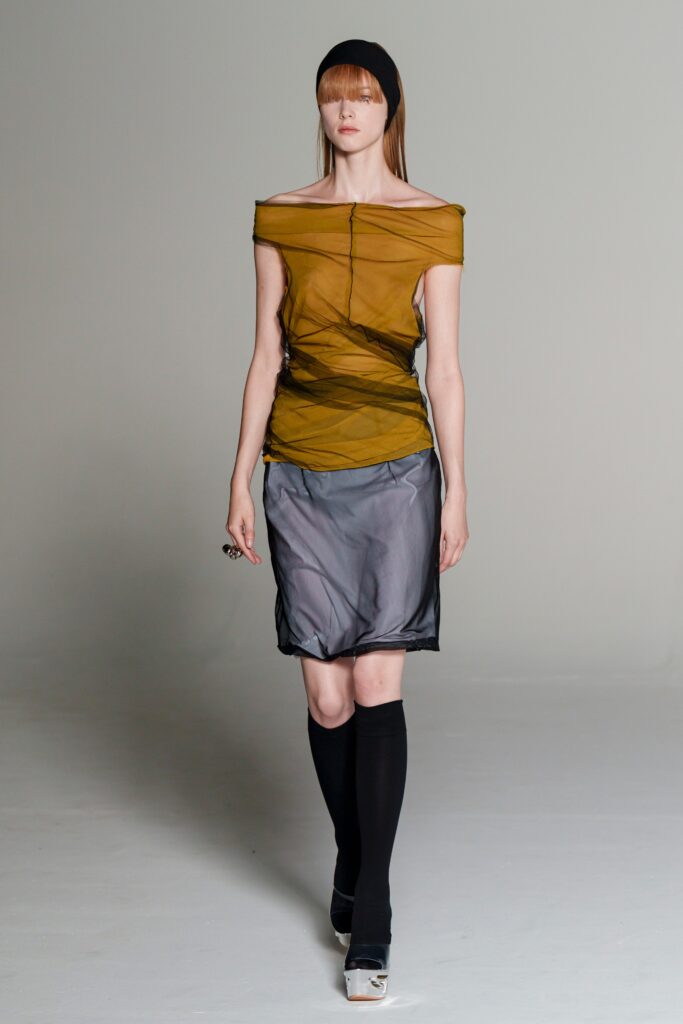 green sheer off-shoulder top with mini skirt