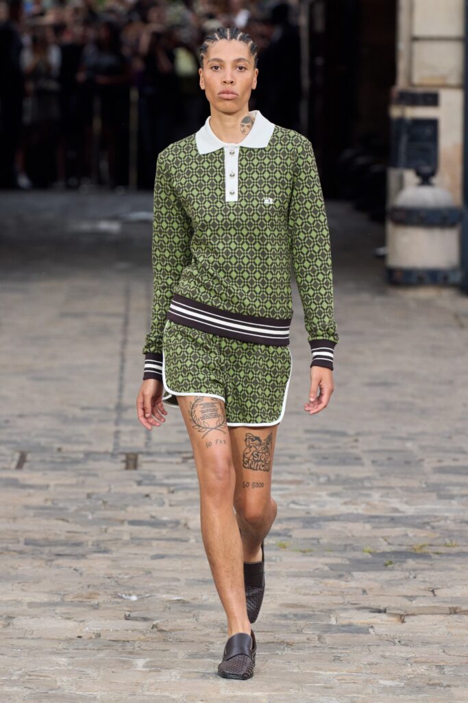A fitted green cotton top with a collar and matching printed shorts.