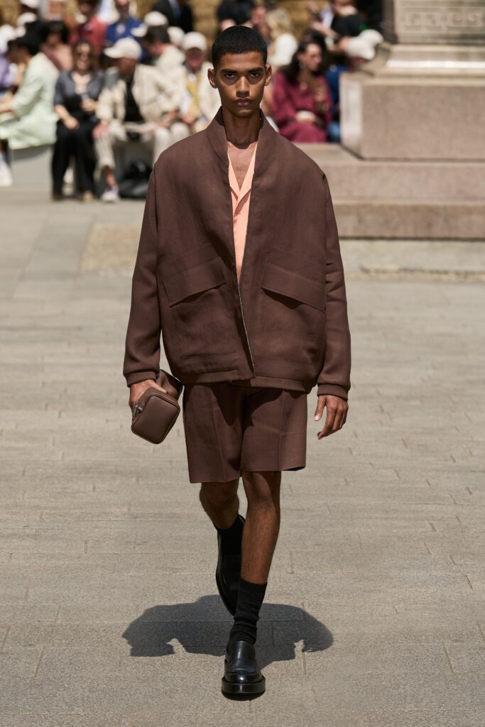 A relaxed brown cotton jacket paired with matching shorts, featuring a collared design.