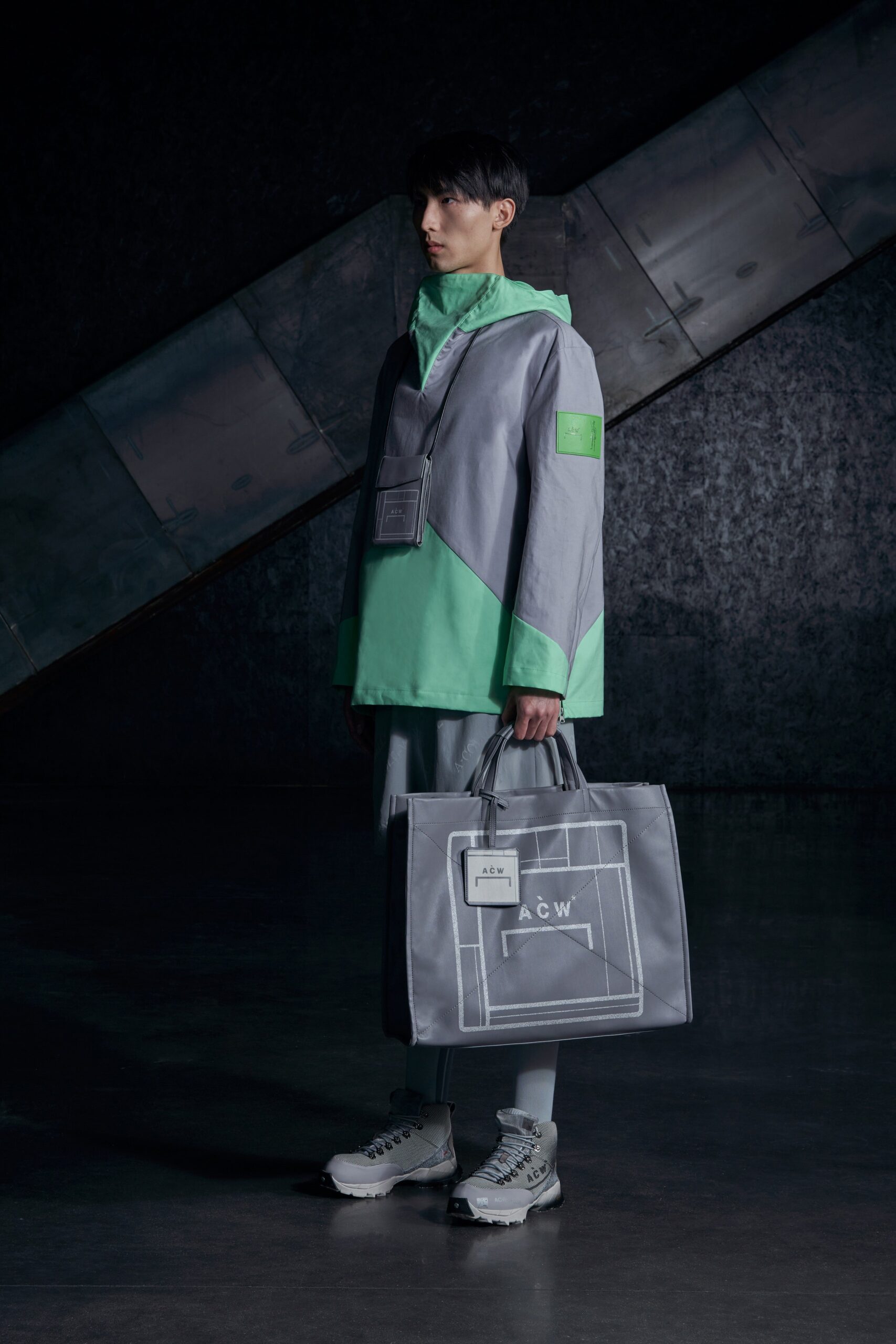 A relaxed gray and green color-blocked hooded jacket paired with matching pants.