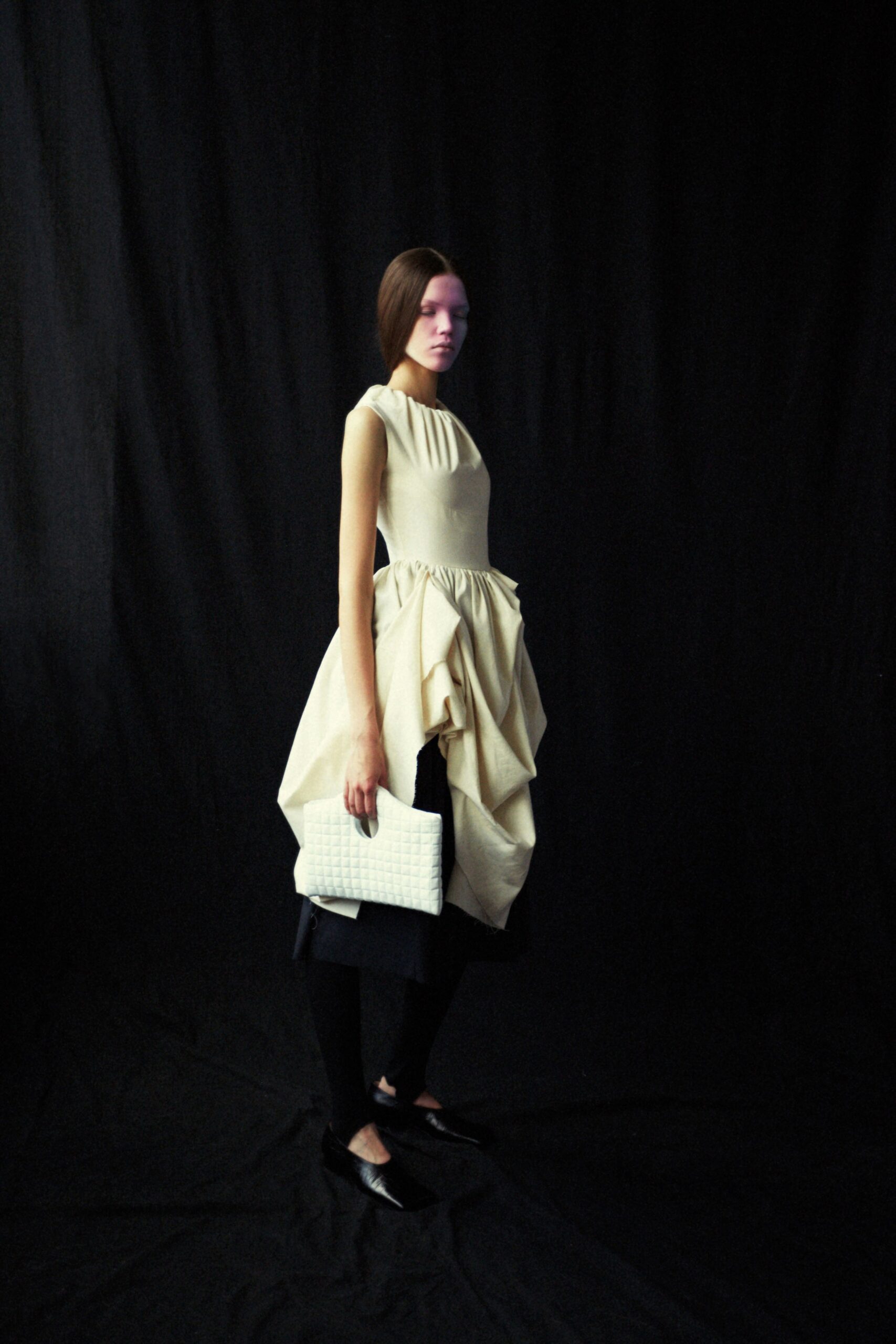 beige draped midi dress with black pants