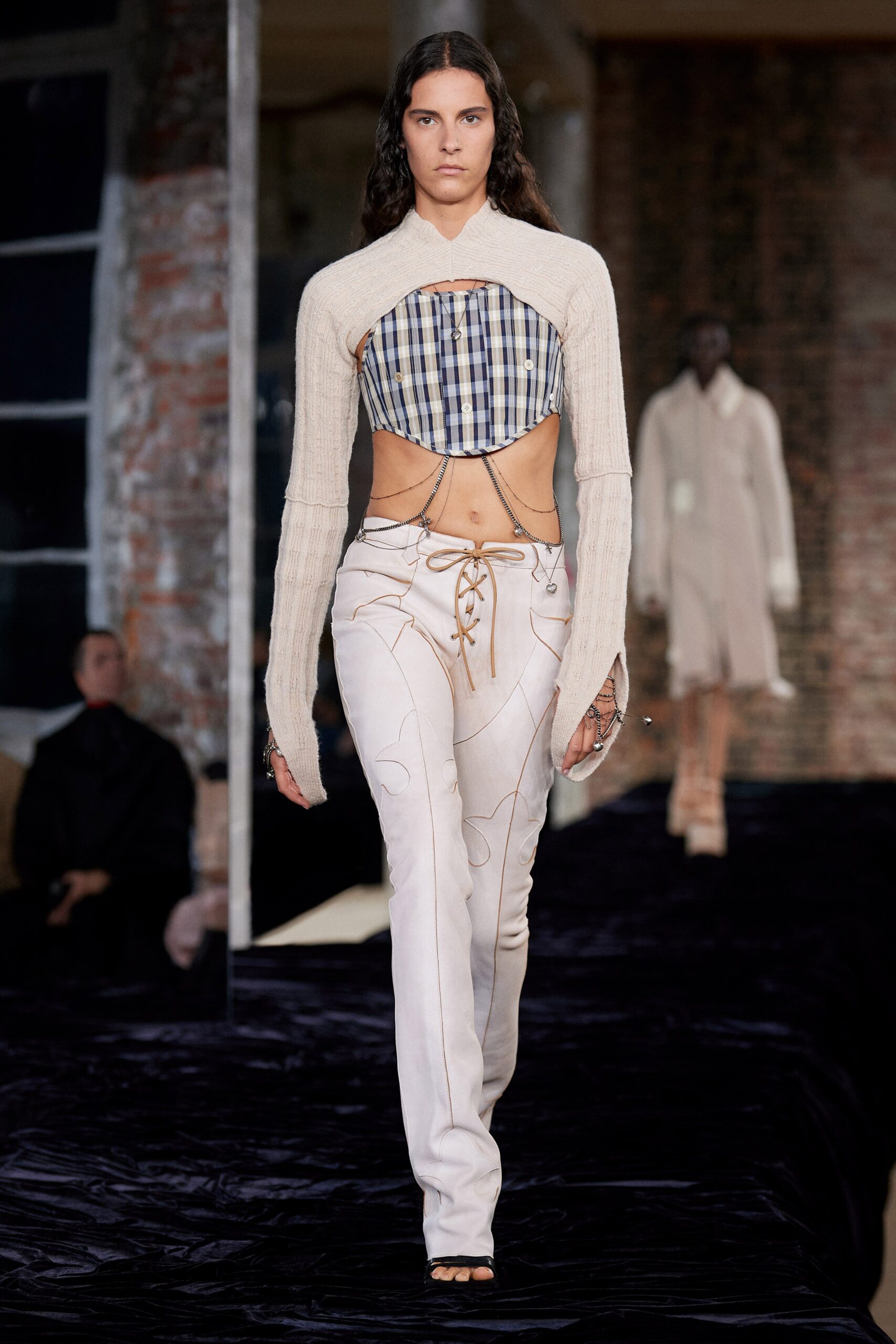 beige cutout top and white pants