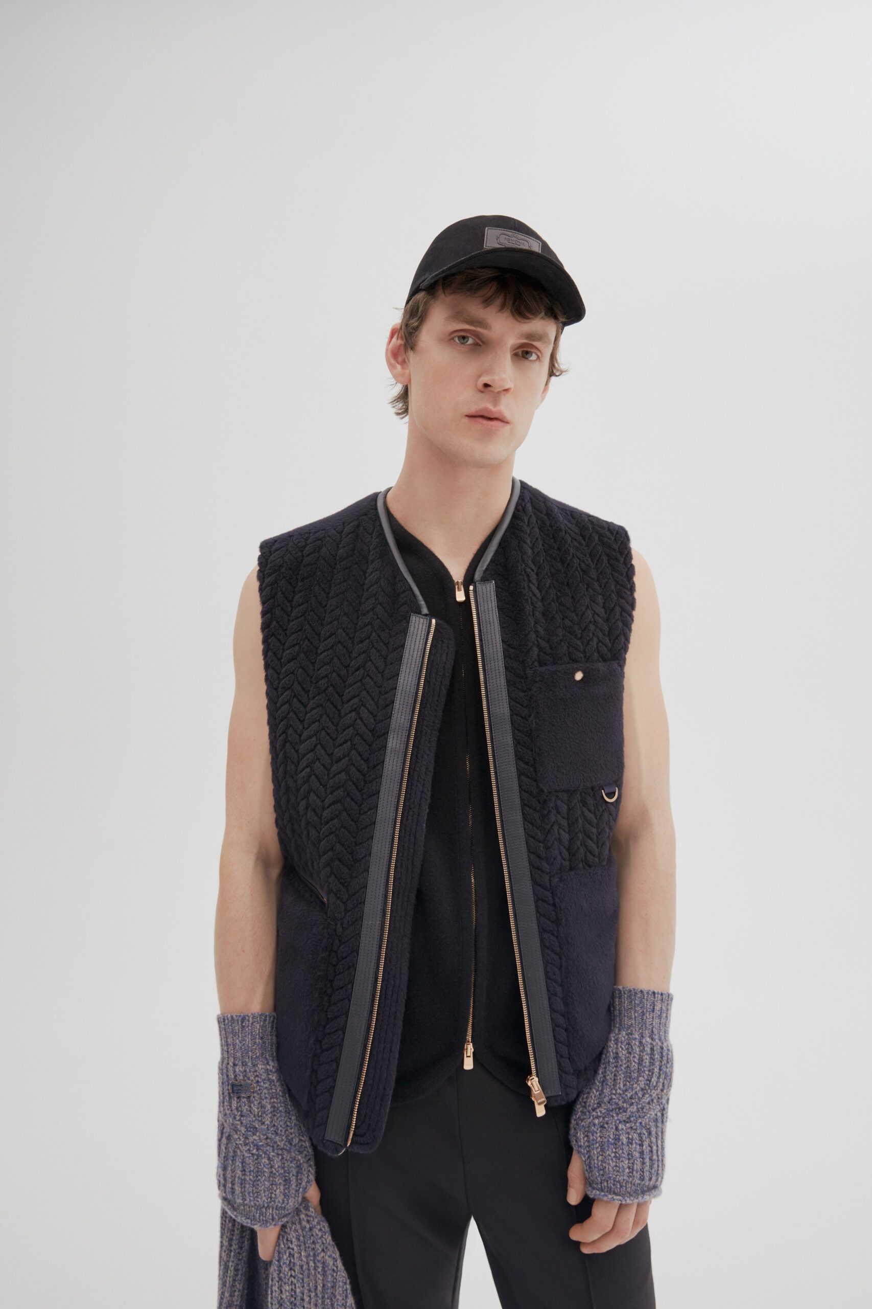 black quilted vest and fitted pants