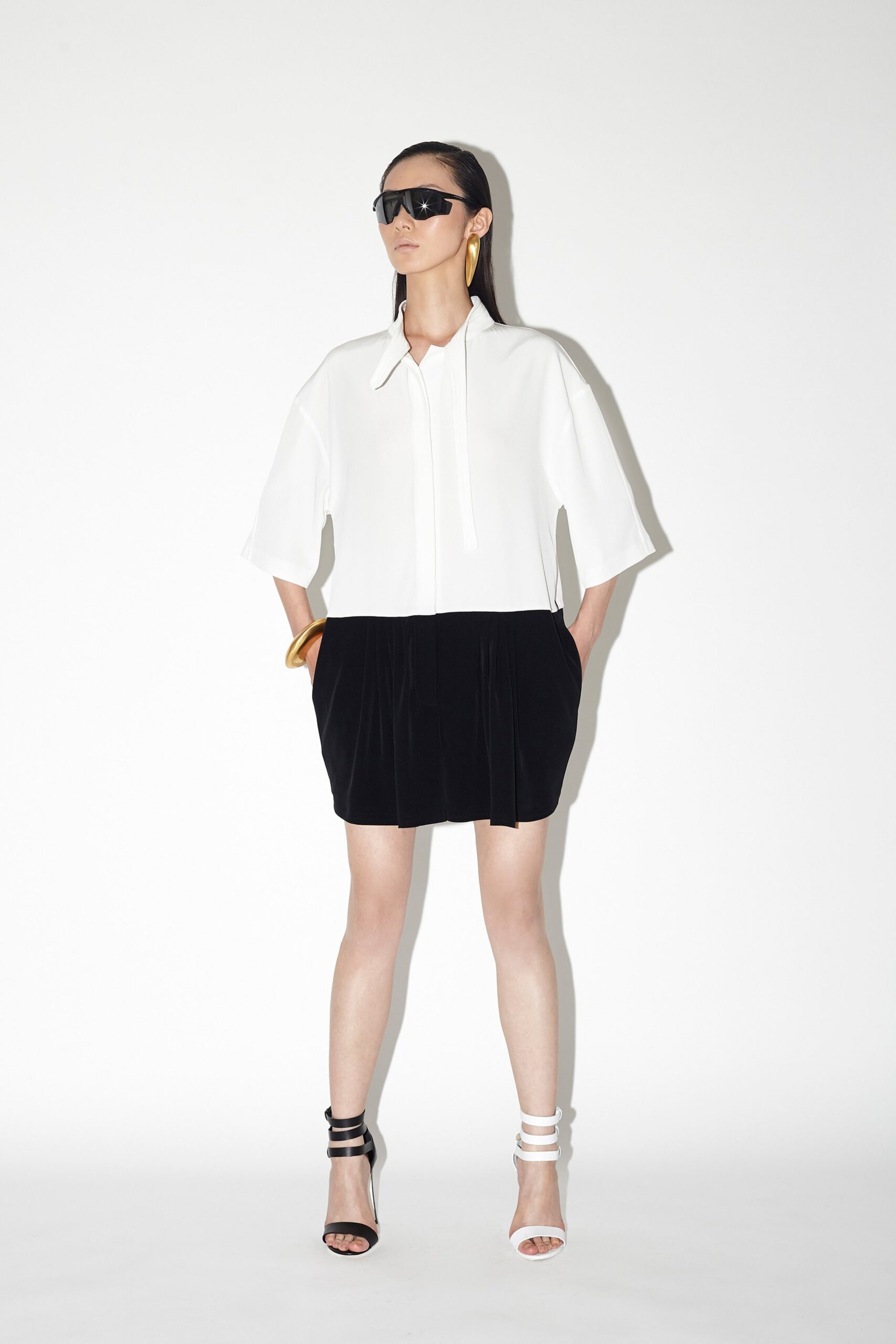 white relaxed top with black skirt