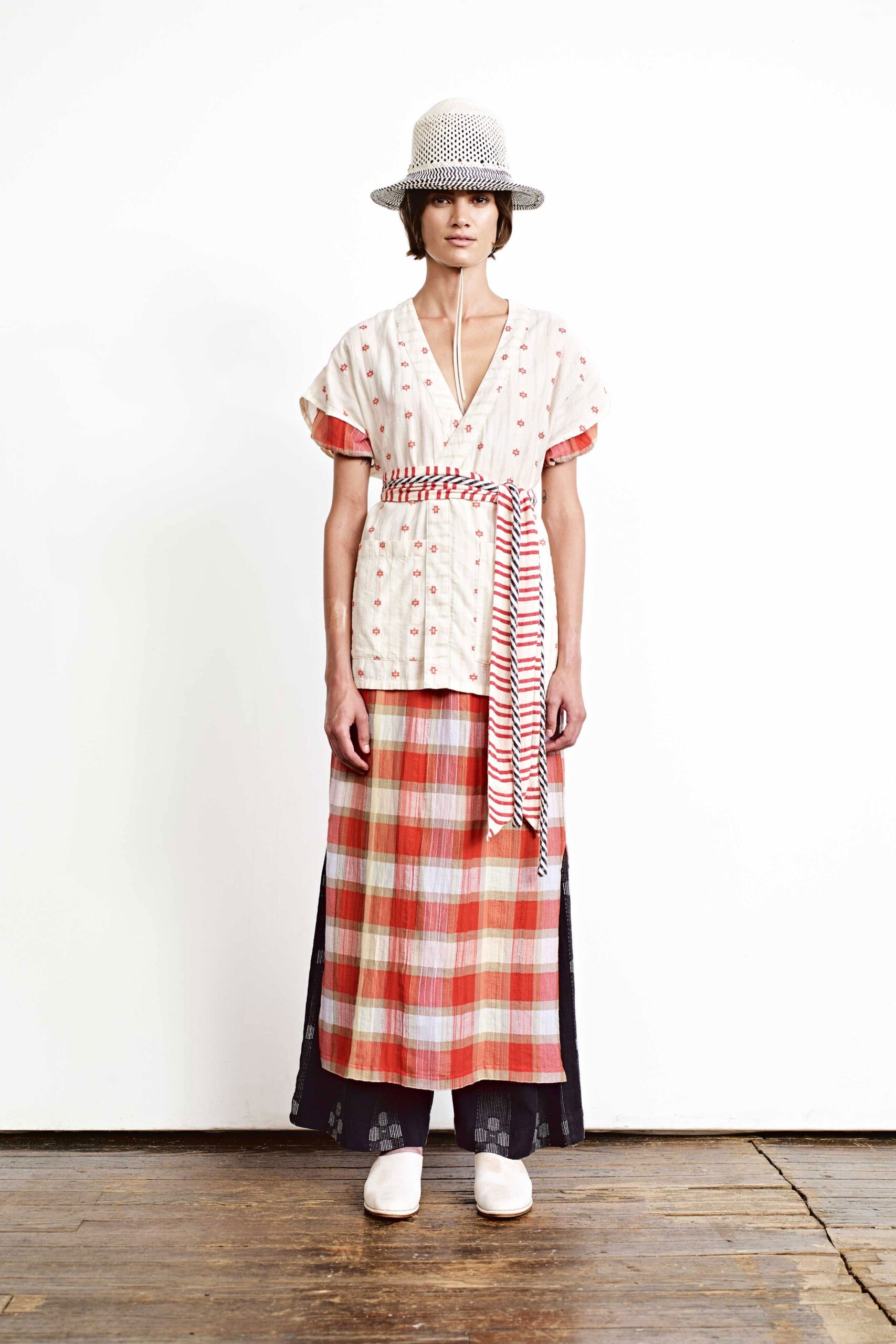 relaxed white embroidered top with plaid maxi skirt