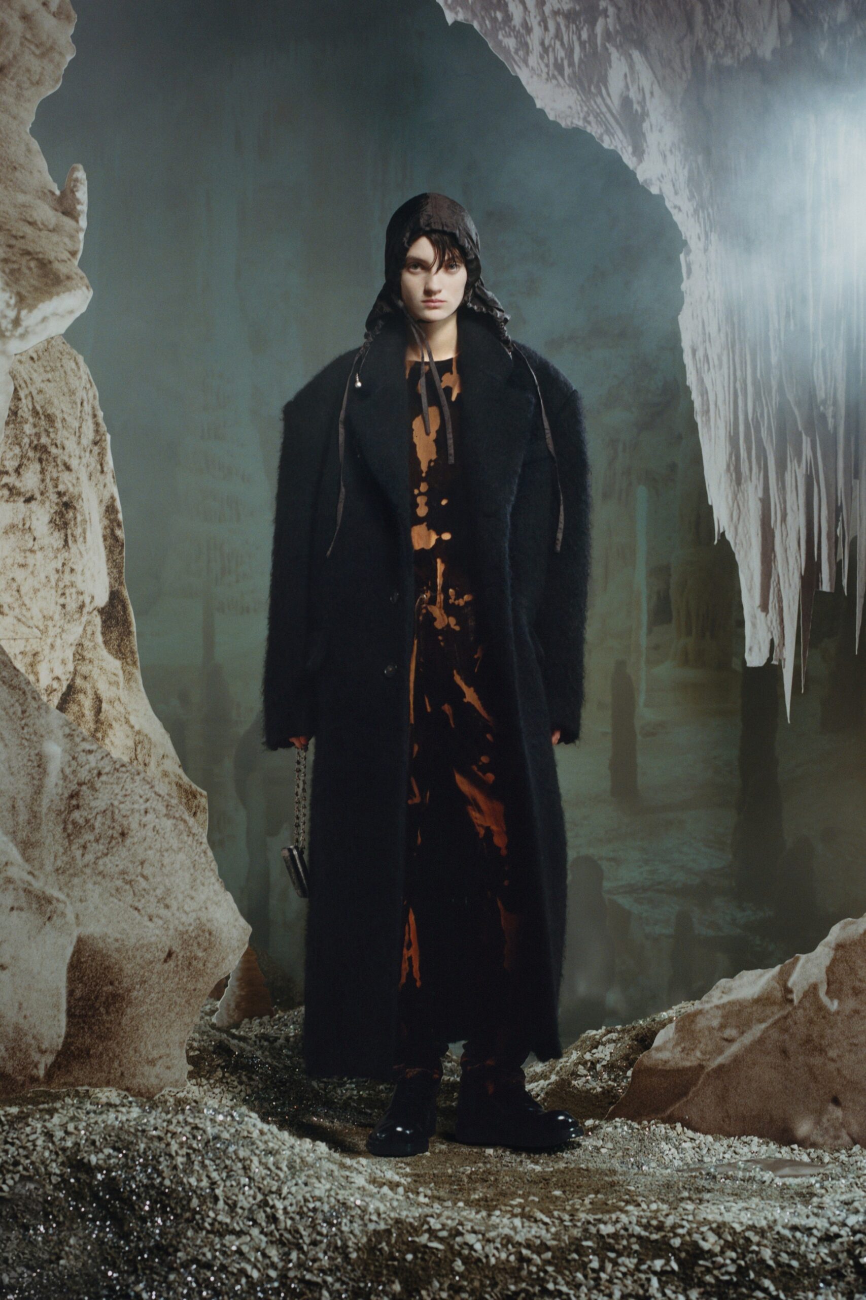 black faux-fur coat and orange silk dress