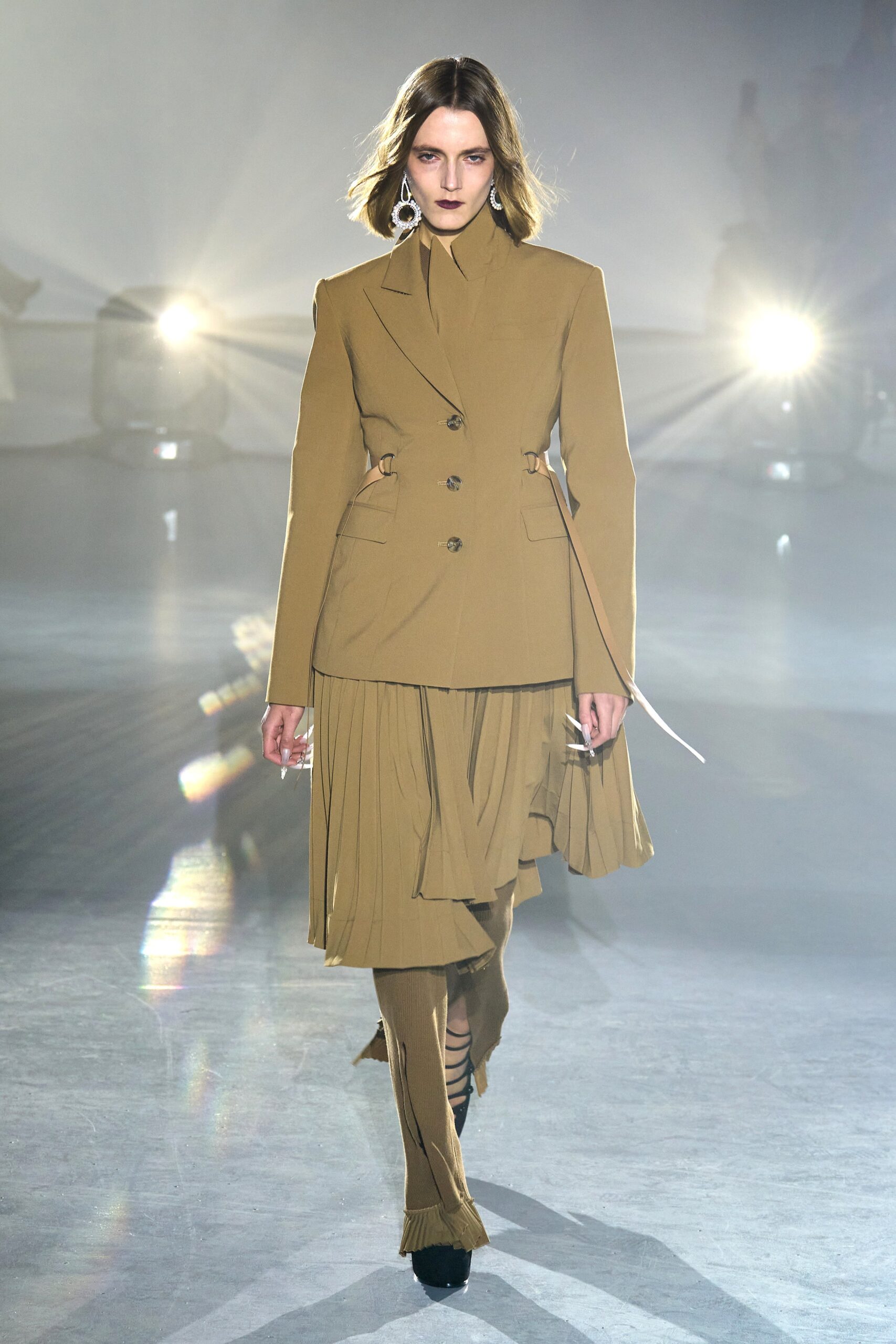 beige tailored blazer with pleated skirt