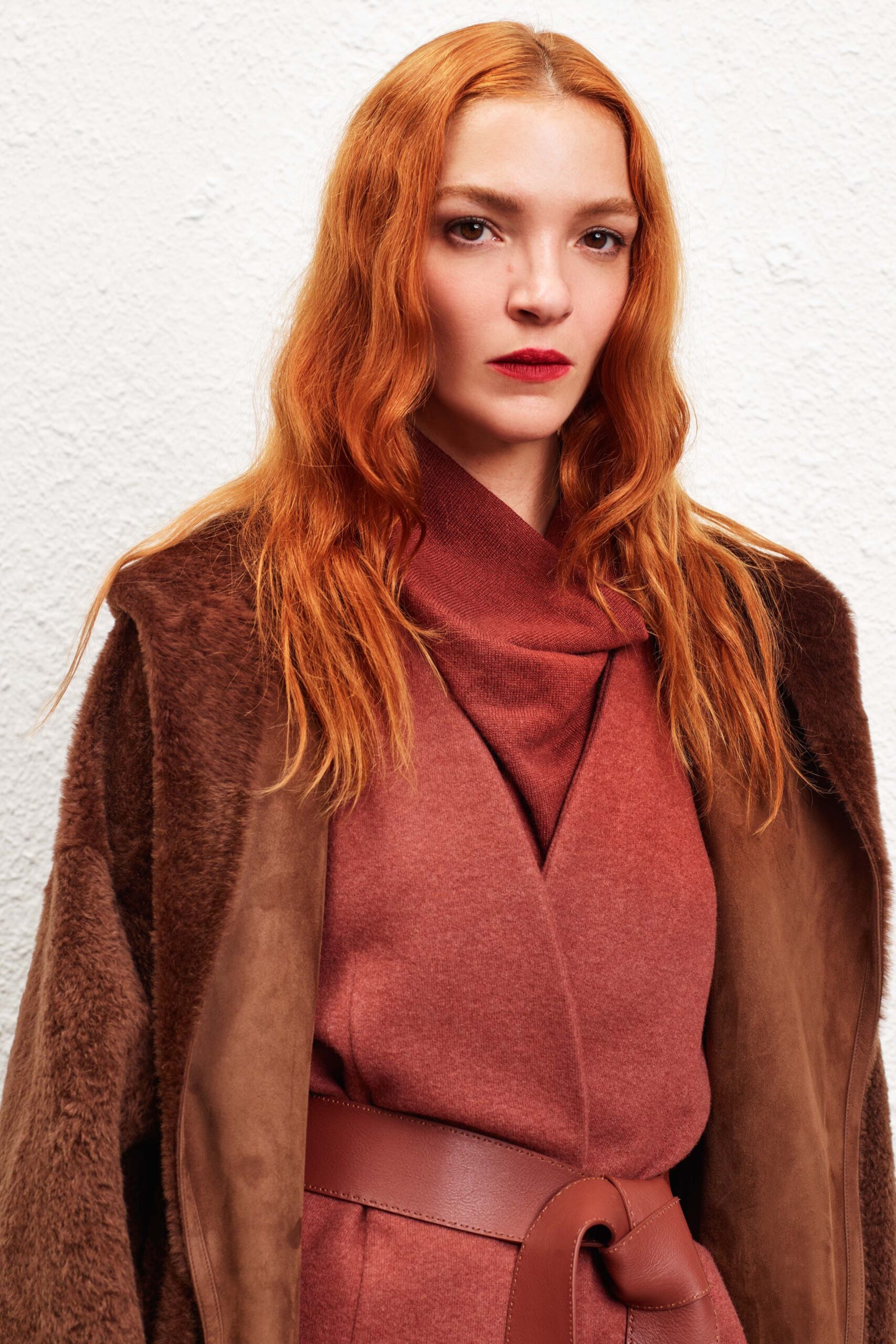 brown faux-fur coat and red dress