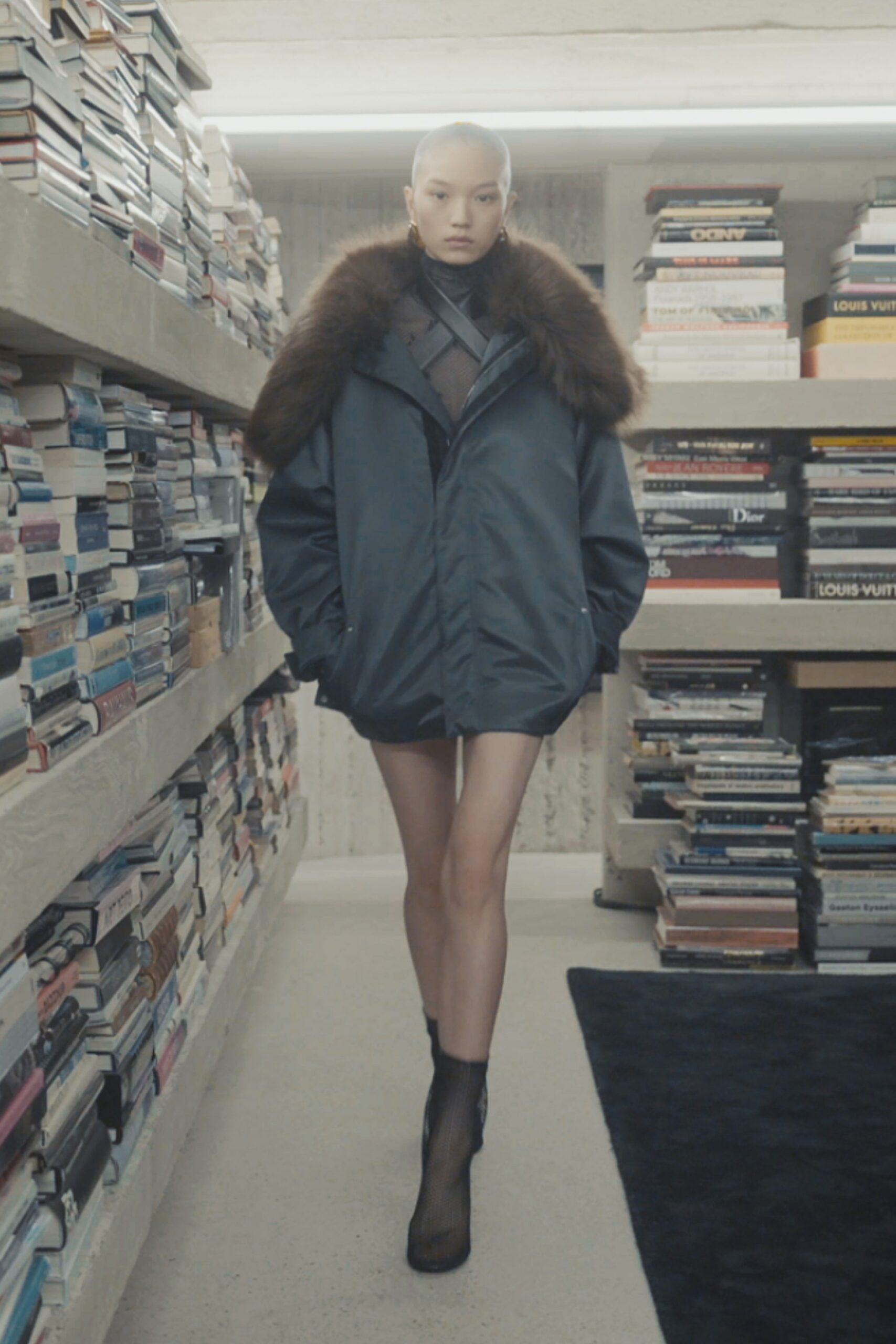 blue parka with black mini dress