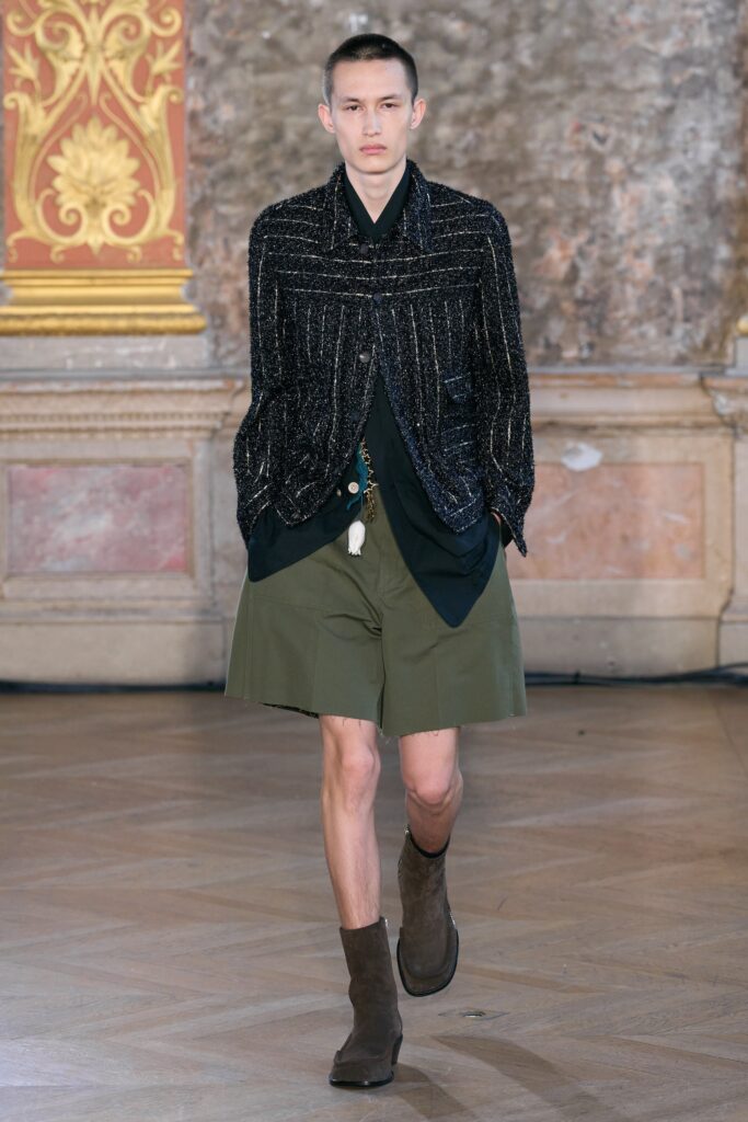 black structured jacket with green shorts