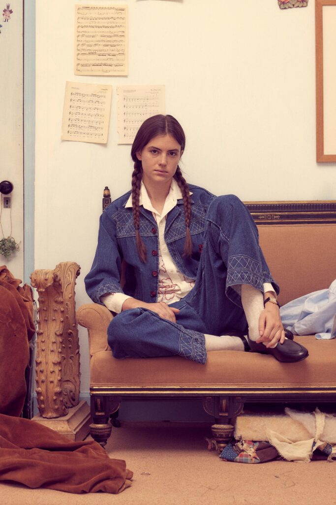 A relaxed blue denim jacket with embroidery paired with matching denim pants.