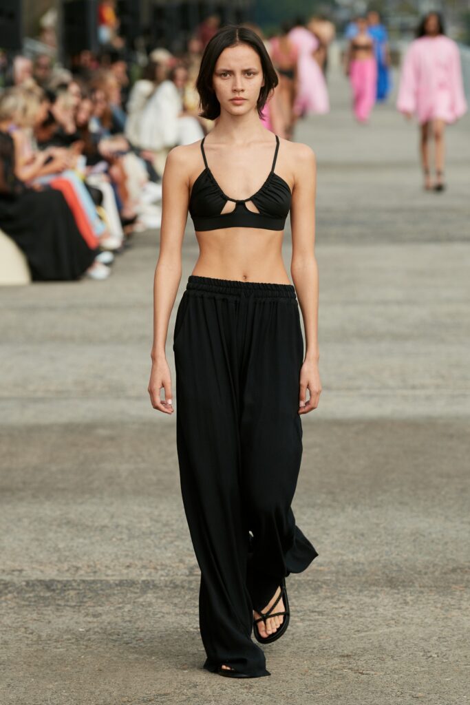 black cutout top and relaxed pants