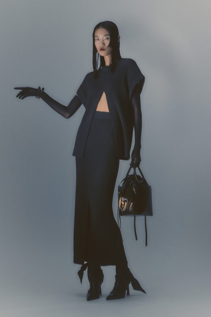 black fitted knit top and skirt