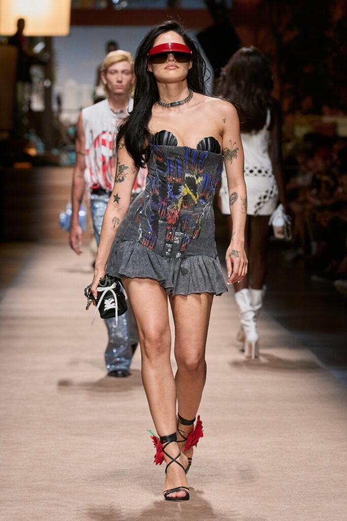A fitted gray strapless dress with ruffled detailing, perfect for a stylish runway look.