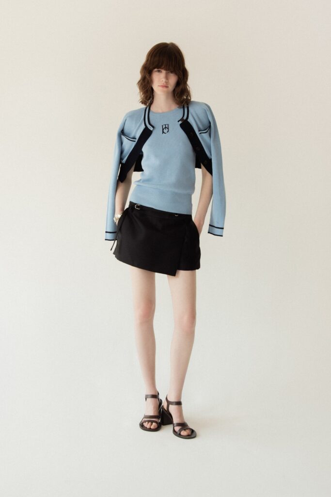 blue fitted top with black mini skirt