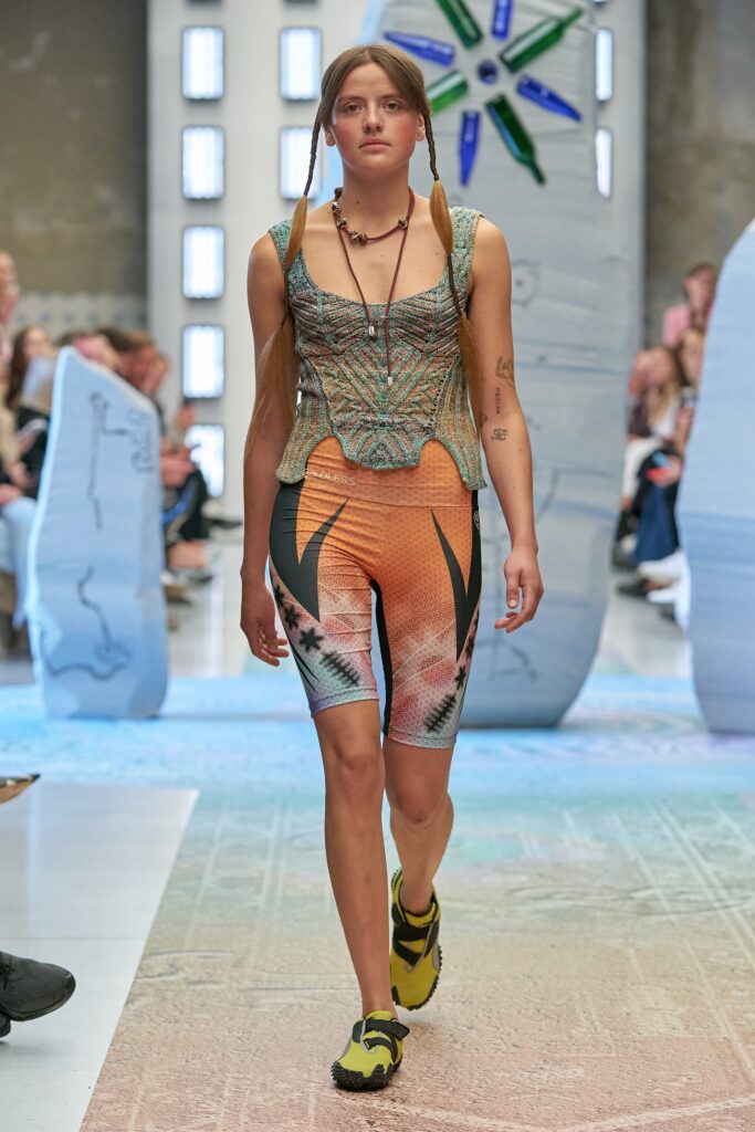 A fitted multicolor sleeveless top with high-neck and printed shorts.