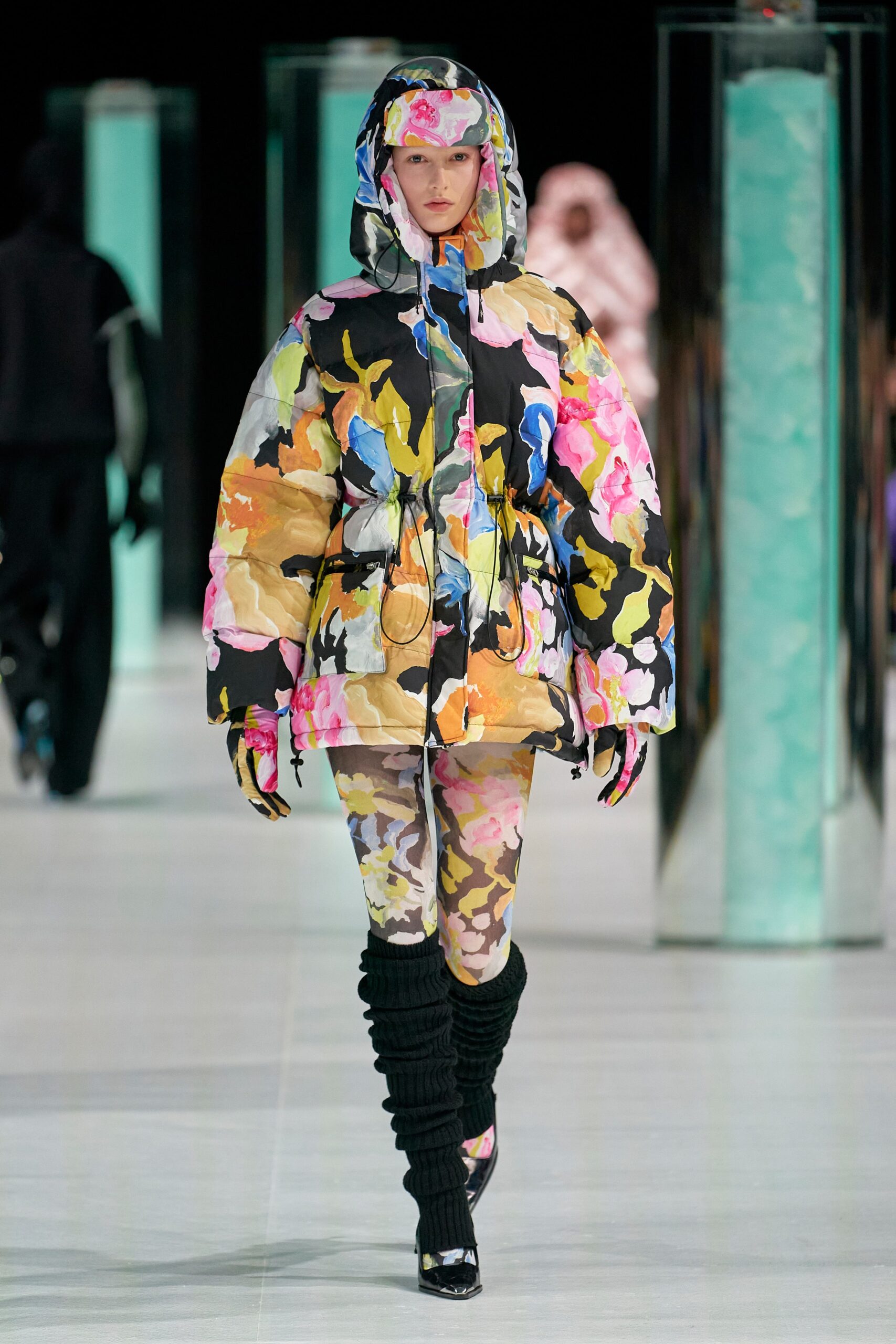 A relaxed multicolor printed jacket with a hood, paired with matching pants.