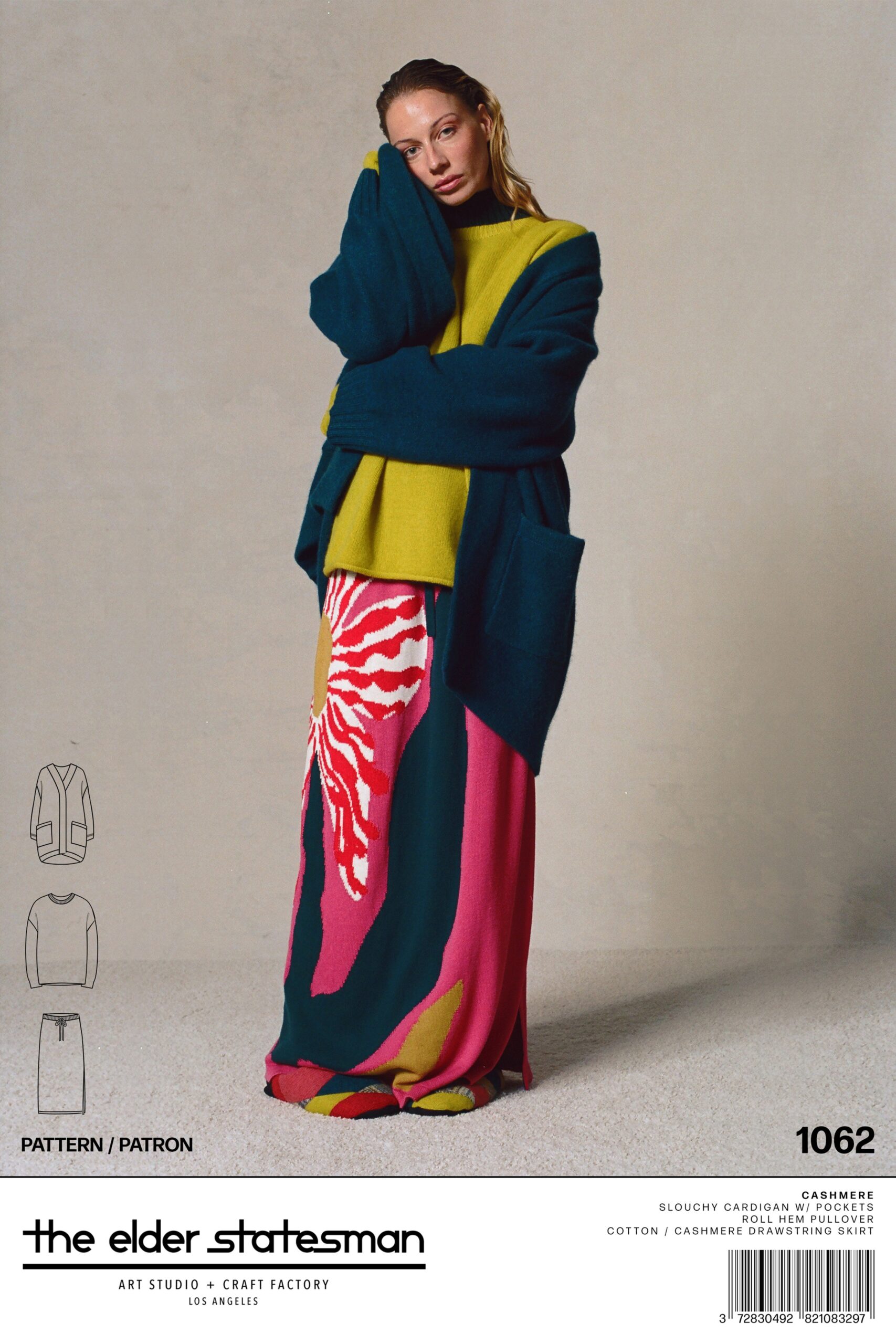 A relaxed long-sleeve green cardigan paired with a printed skirt in vibrant colors.