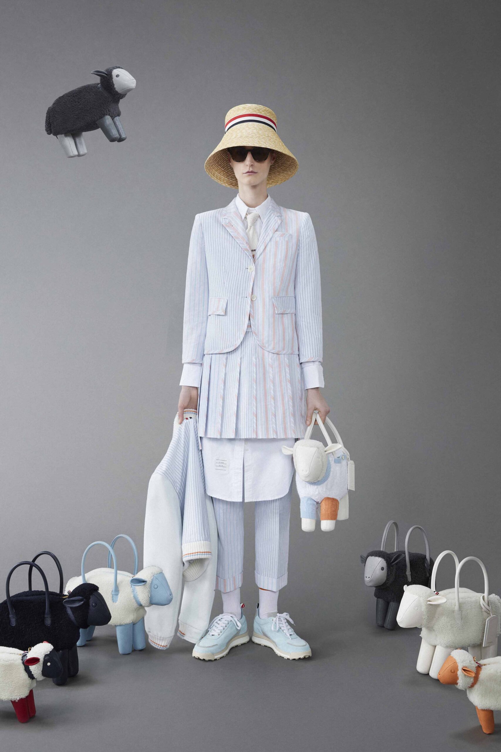 A fitted blue and white striped suit with a pleated skirt and collared shirt.