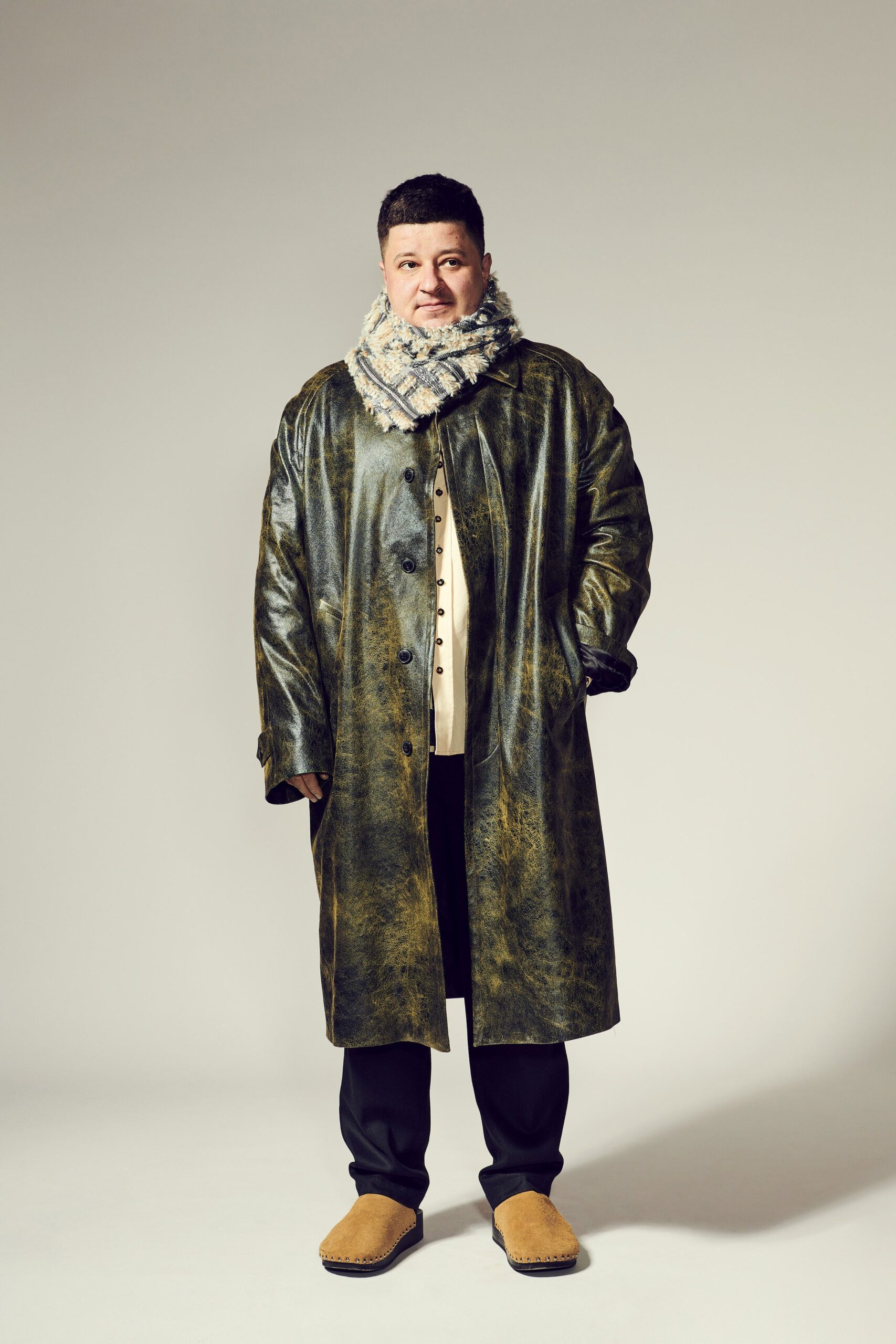 green leather coat with scarf