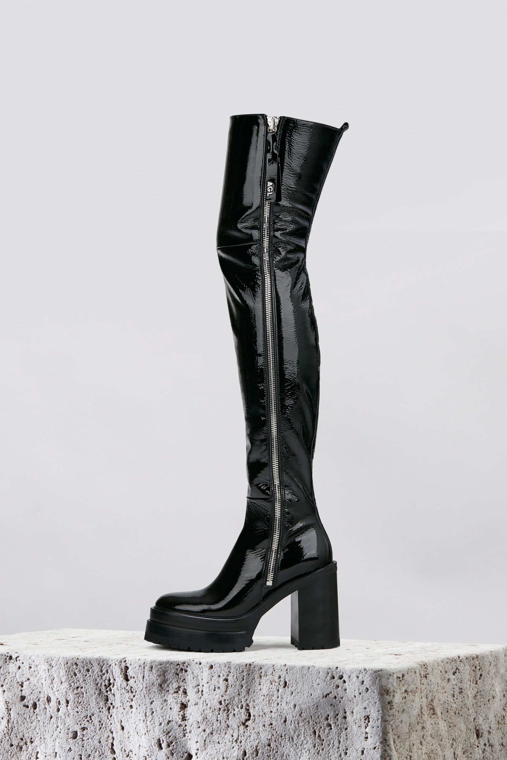 black vinyl fitted boots