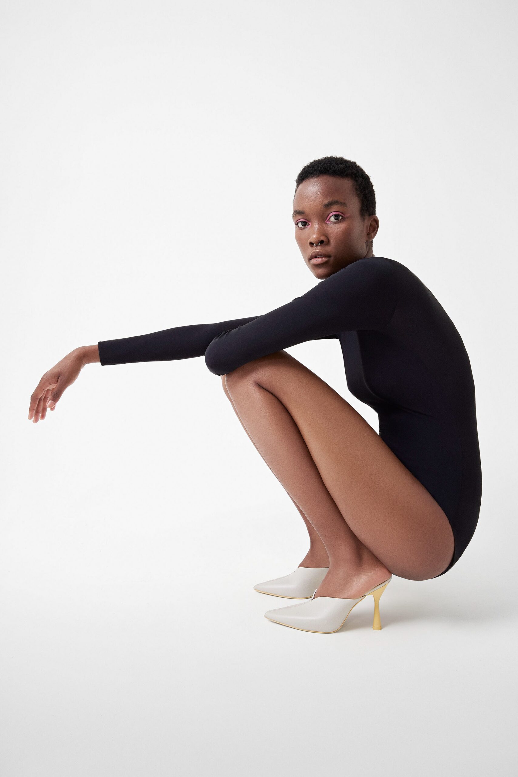 black bodysuit with heels