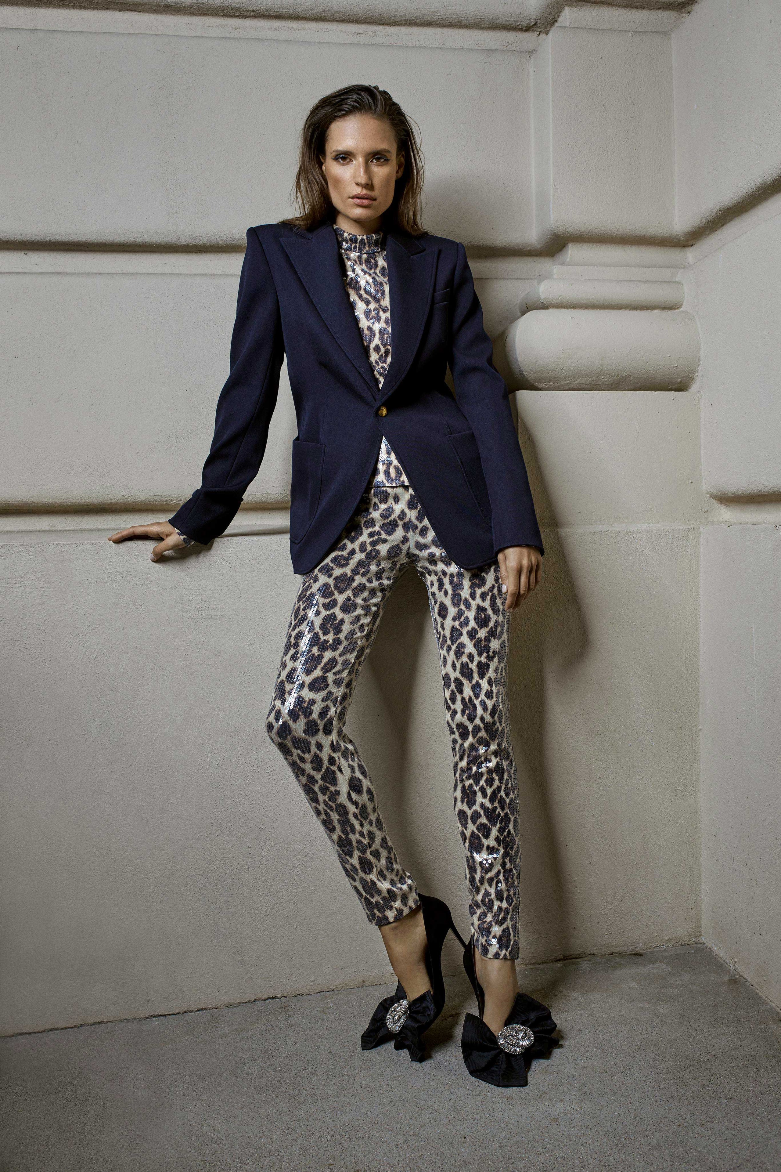 black tailored blazer and animal-print pants