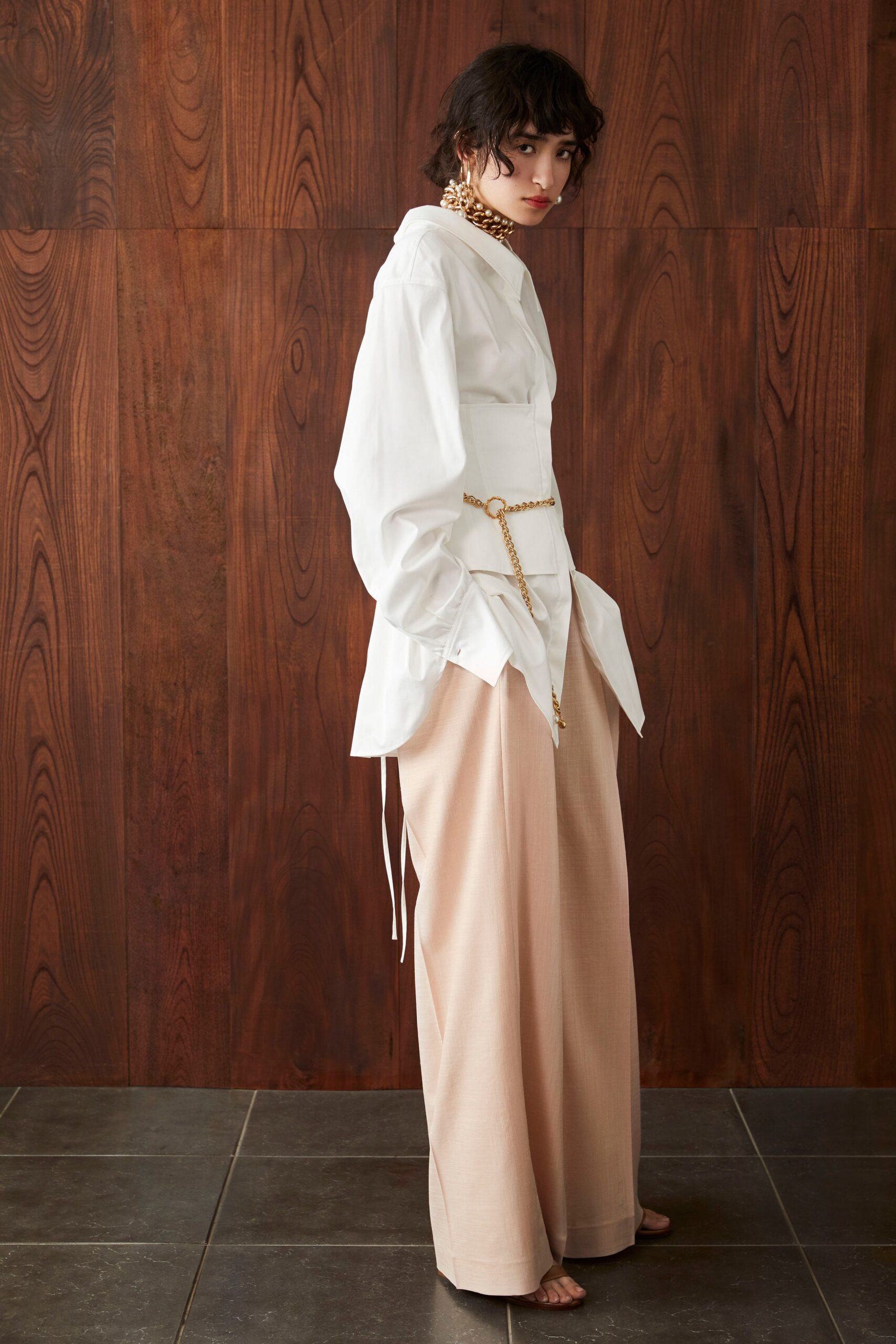 white relaxed shirt and beige wide-leg pants