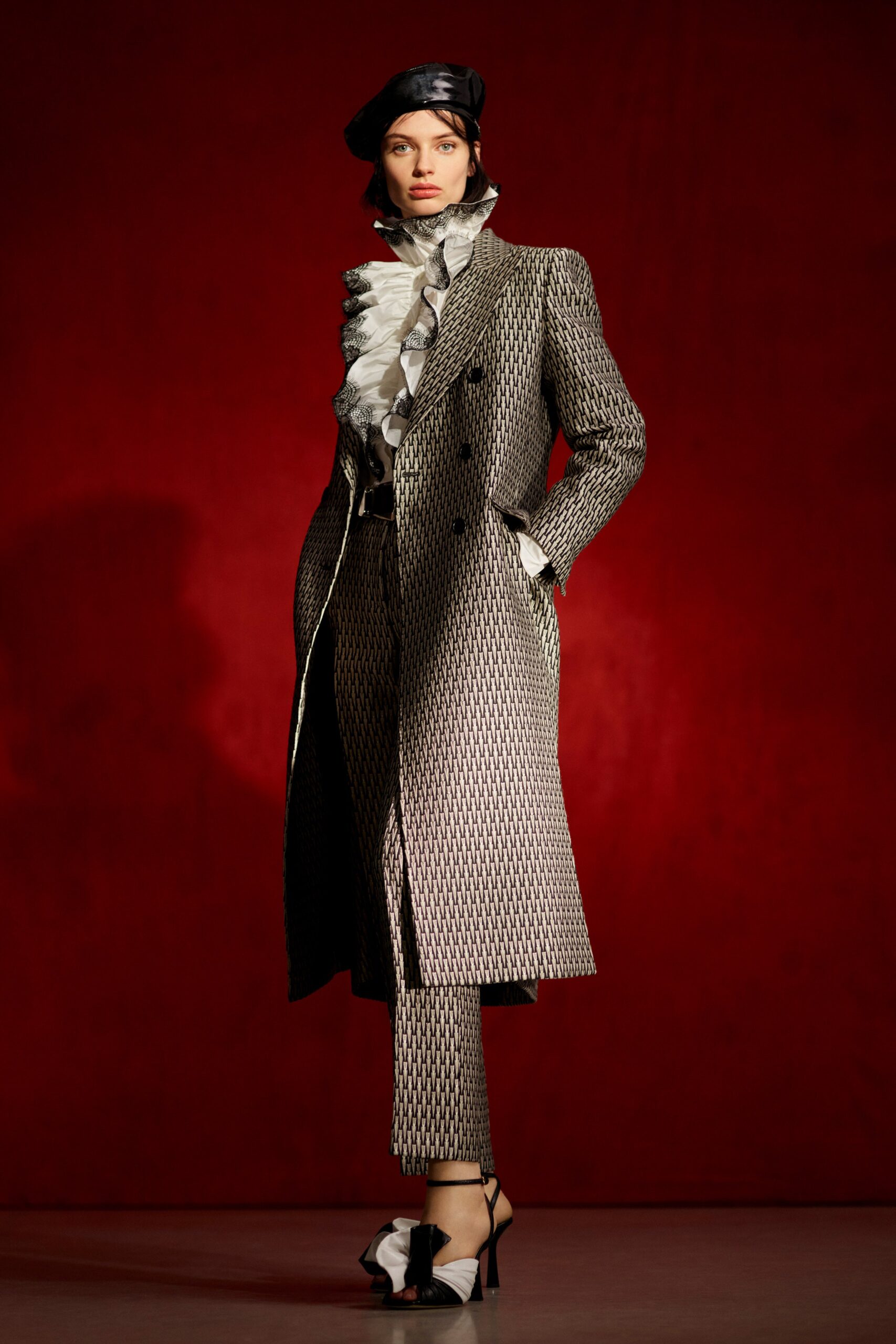 black and white printed coat with ruffled blouse