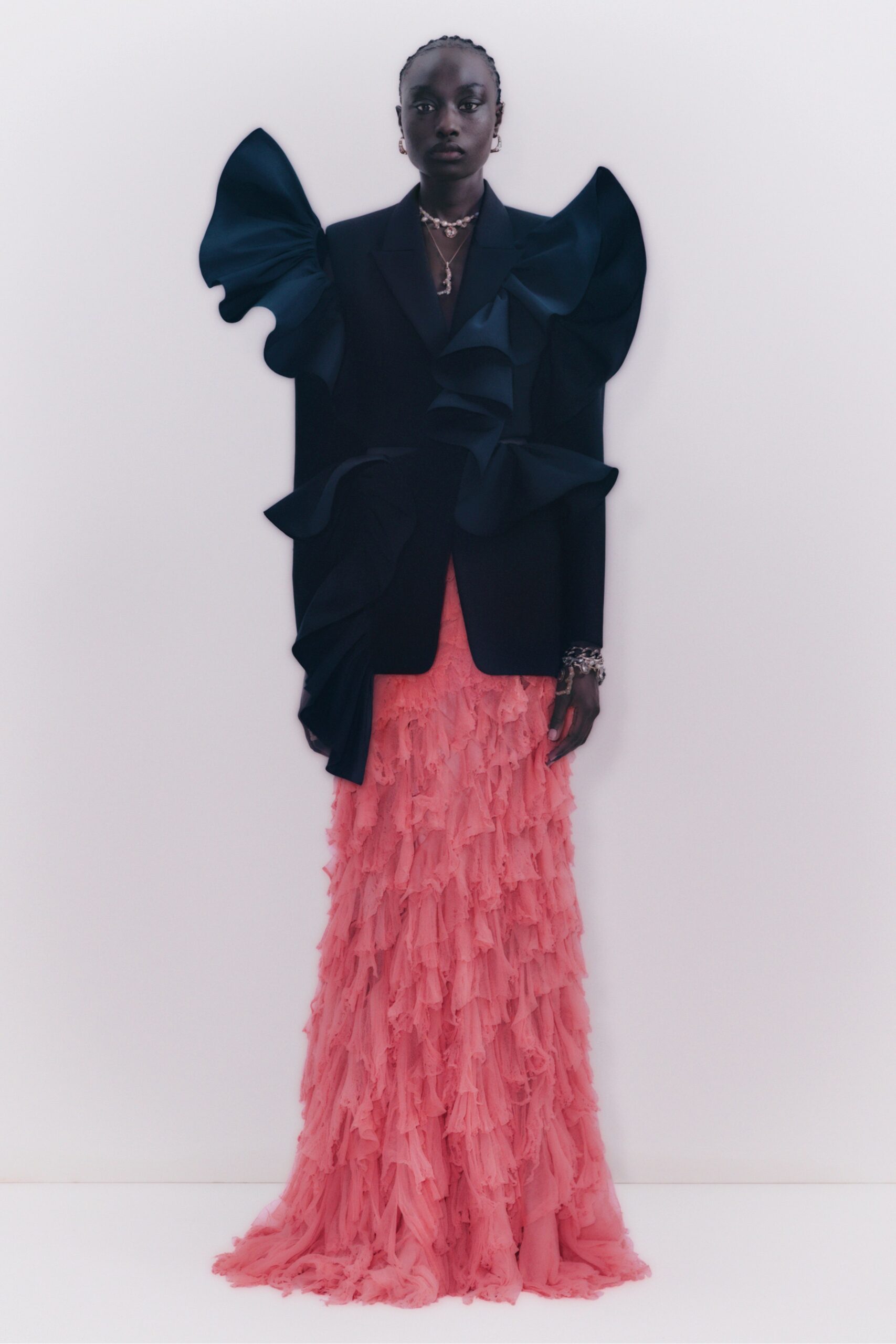 black ruffled blazer and pink gown