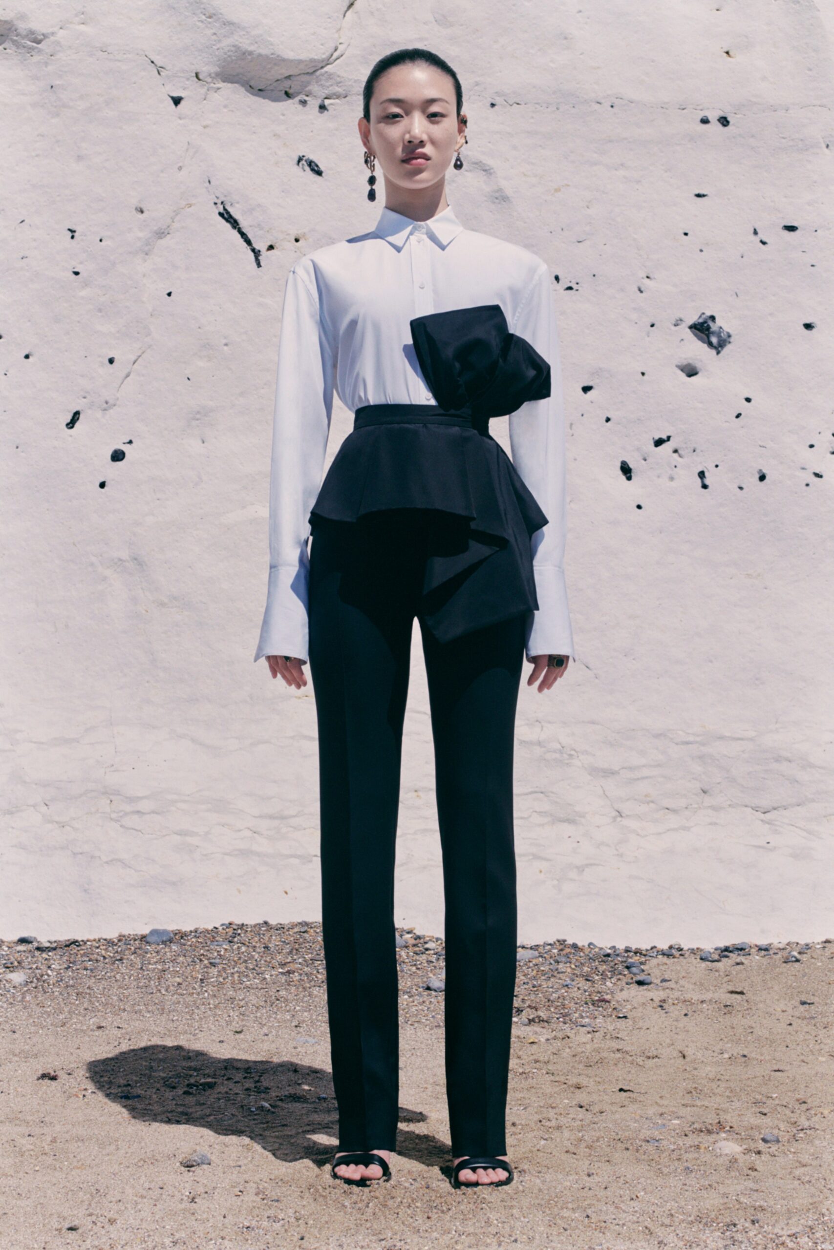 white fitted shirt with black pants