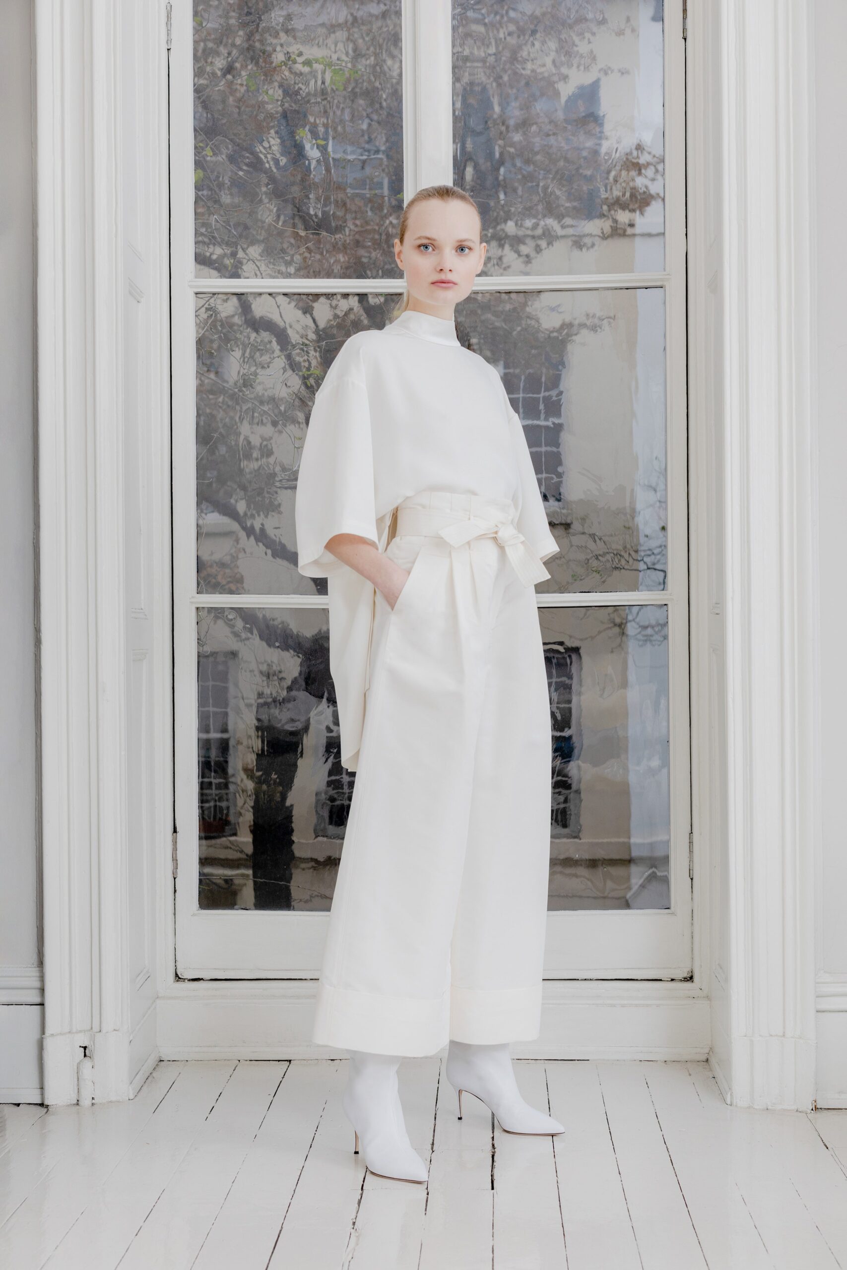 white cotton short-sleeve high-neck relaxed belted top