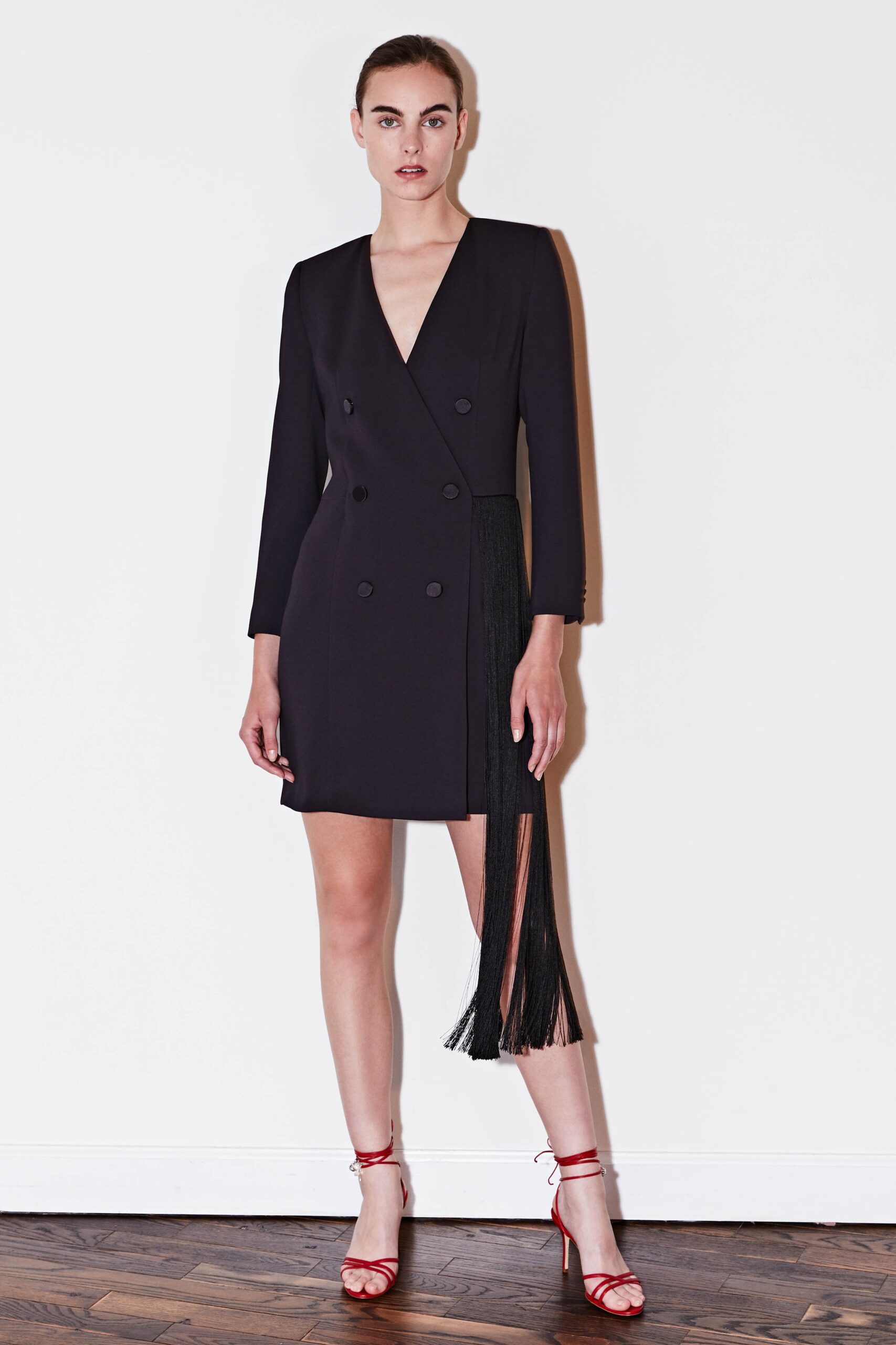 black fitted dress with fringe
