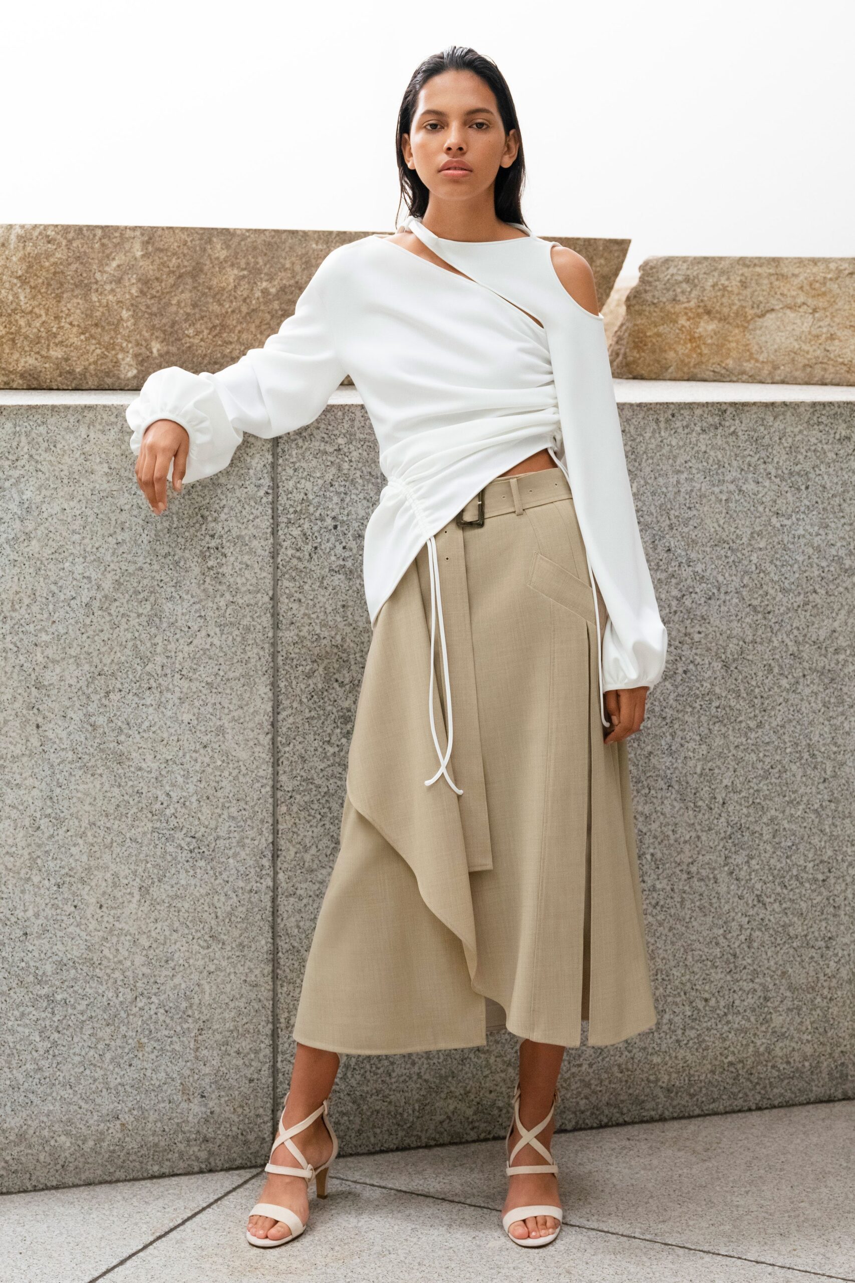 white asymmetric top beige skirt