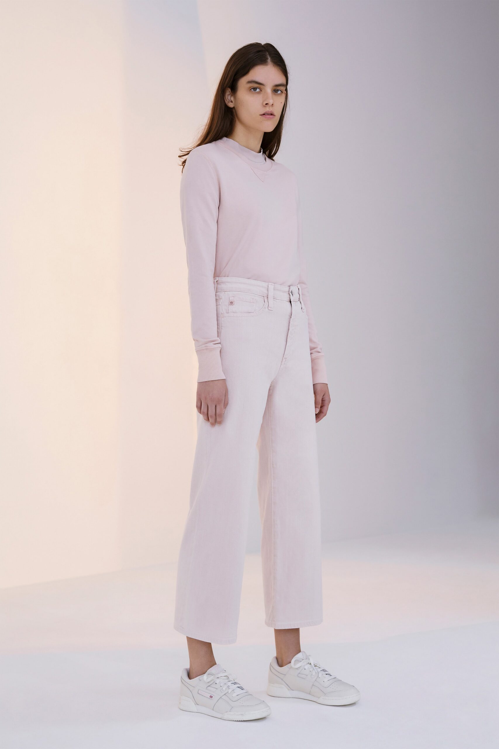 pink fitted top with white pants