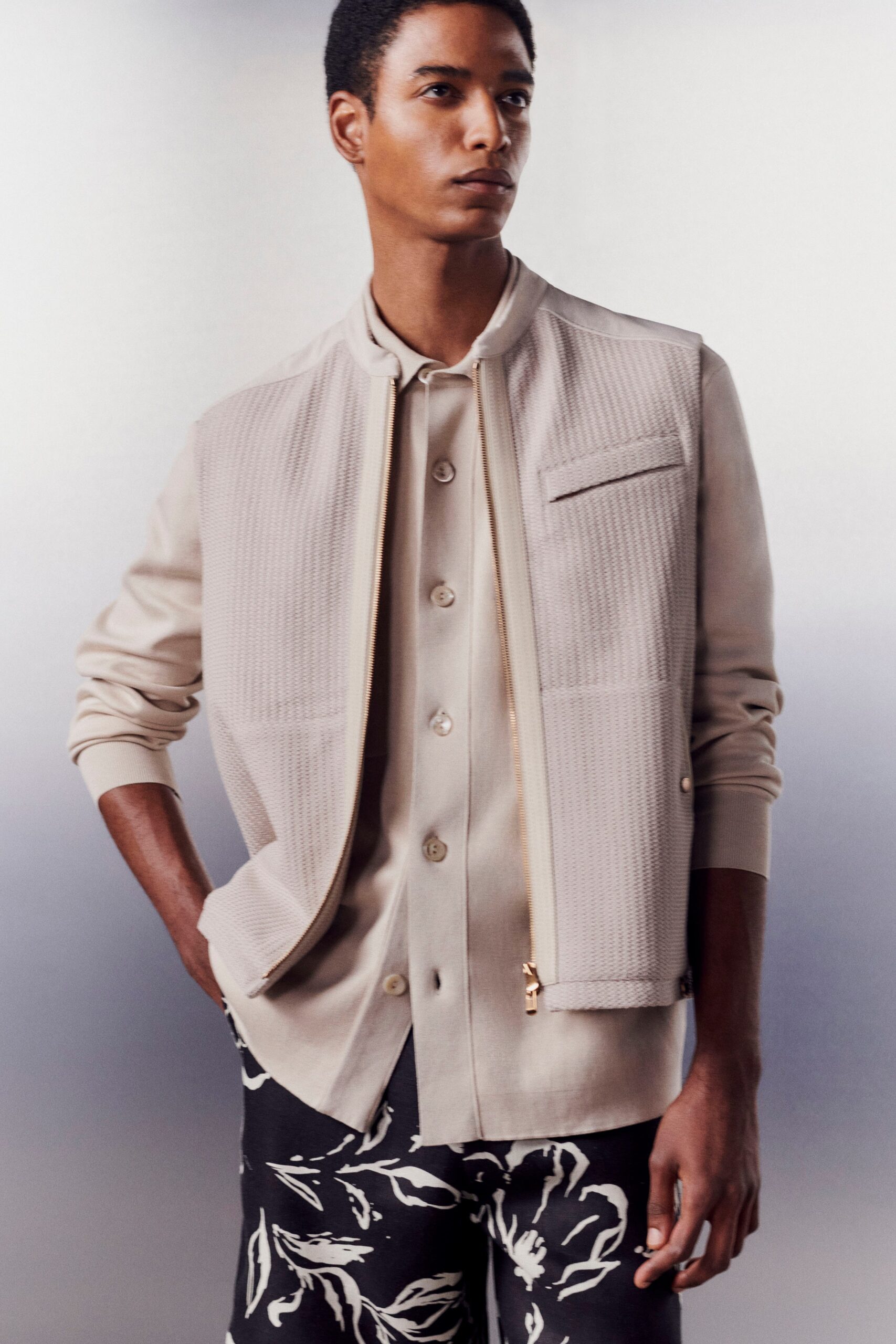 beige jacket white shirt black pants