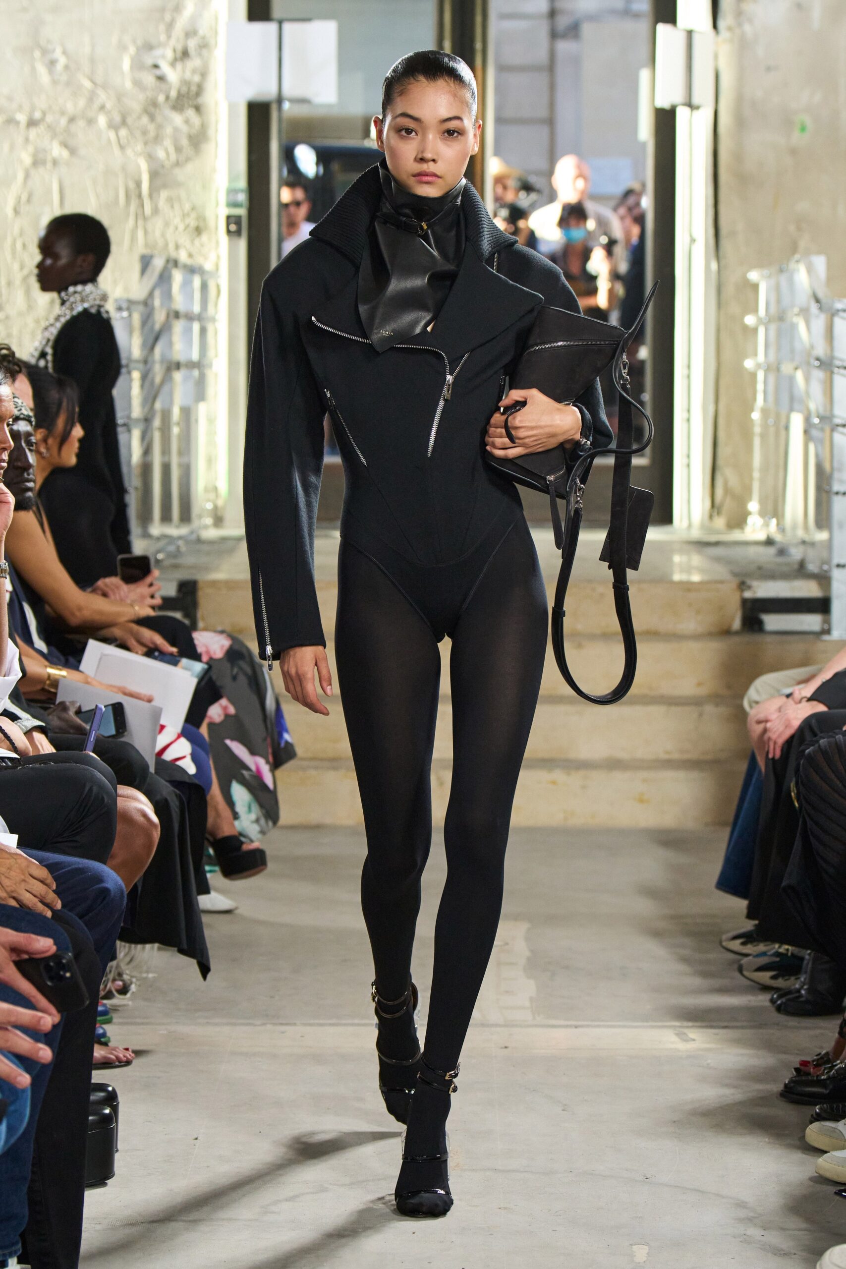 black fitted neoprene catsuit