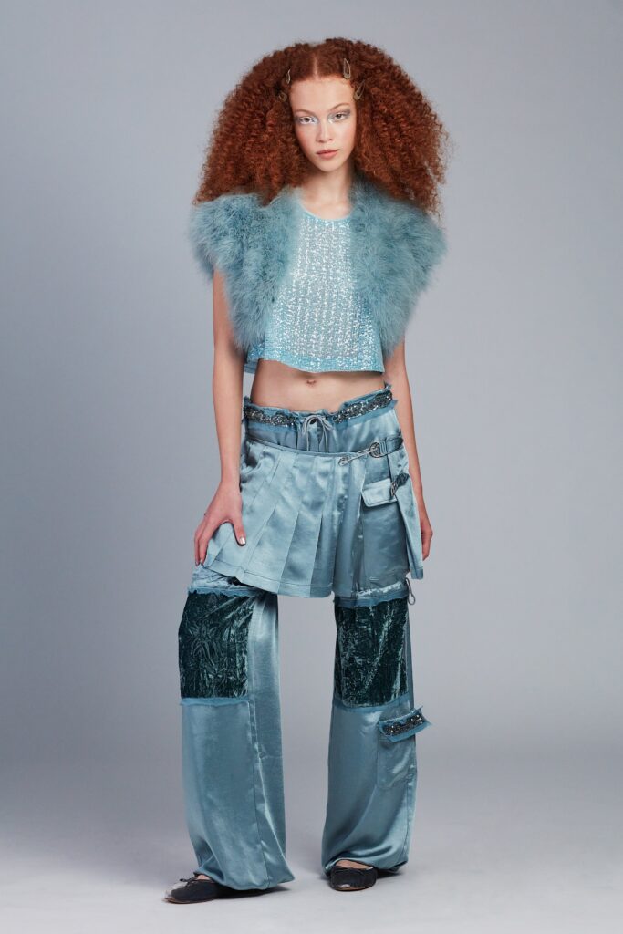 blue sequined sleeveless top and relaxed pants