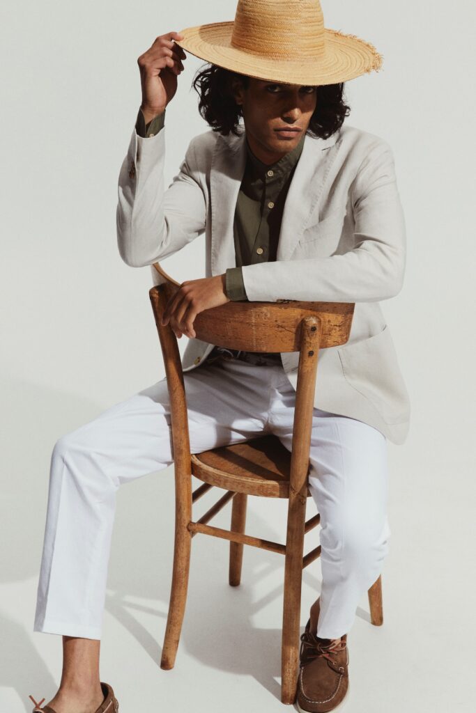 A tailored beige blazer paired with white straight-leg pants, perfect for a stylish look.