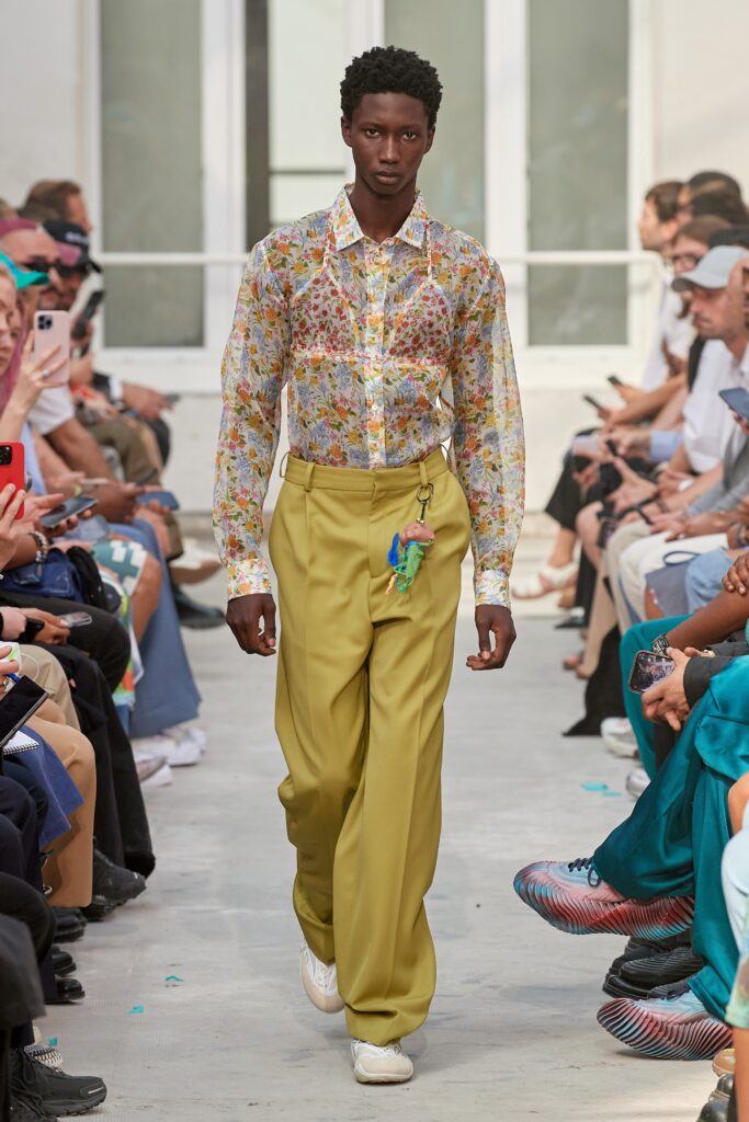 A relaxed floral long-sleeve shirt paired with relaxed yellow pants.