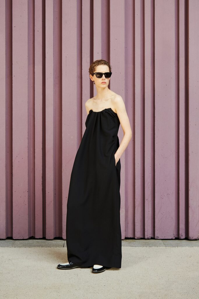 A relaxed black strapless maxi dress with a flowing silhouette.