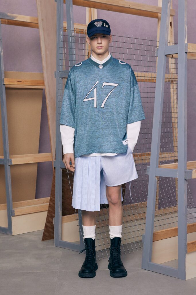 An oversized blue shirt paired with white shorts, creating a relaxed and casual look.